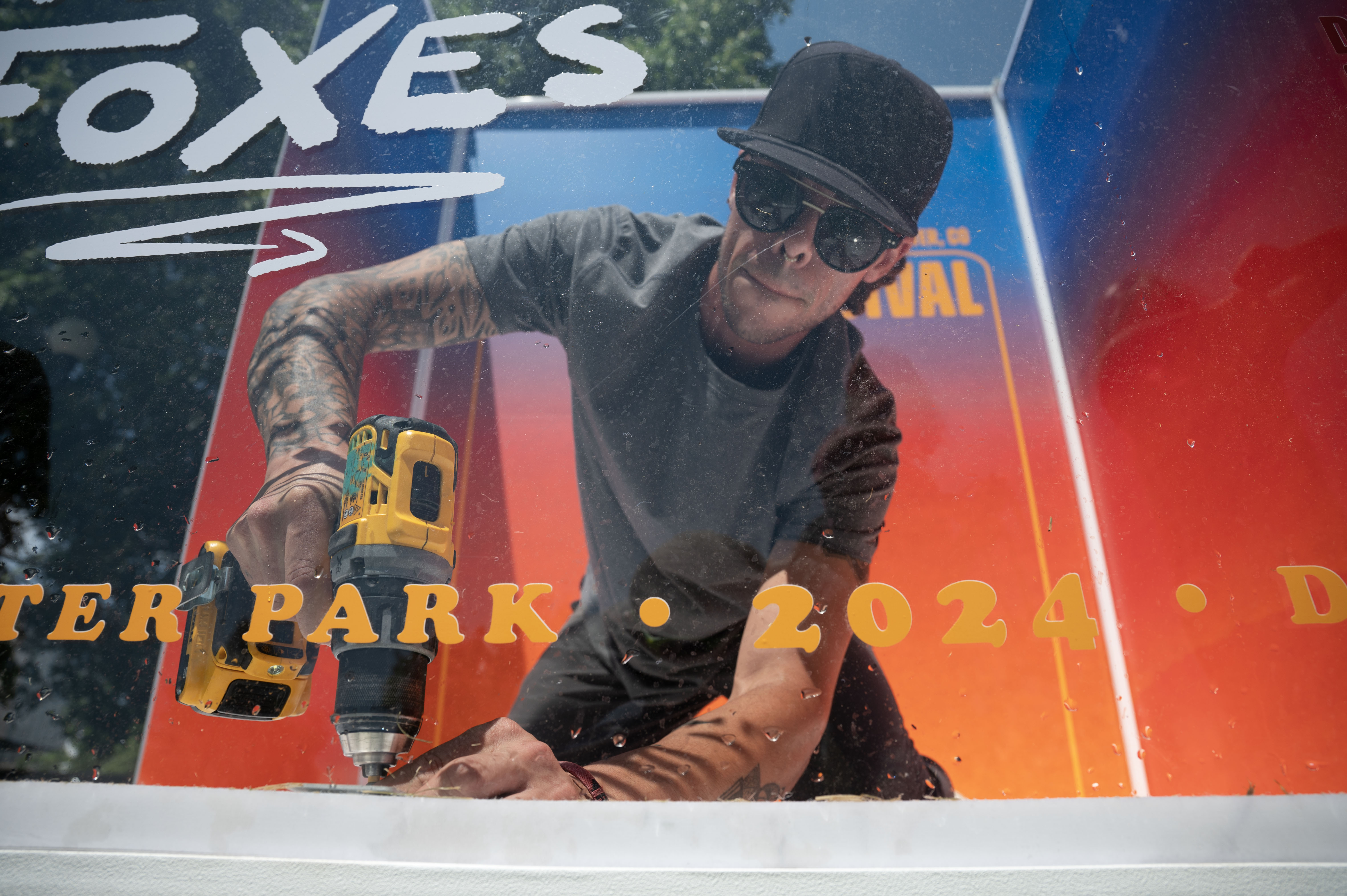 Elijah Baker helps set up a booth at the inaugural Outside Festival at Civic Center Park on Friday, May 31, 2024. The festival runs Saturday and Sunday. (Stephen Swofford, Denver Gazette) (StephenSwoffordPhotographerstephen.swofford@gazette.comhttps://secure.gravatar.com/avatar/1ddcaf11c5d70eaa58546ddc4e038687?d=mm&r=g)
