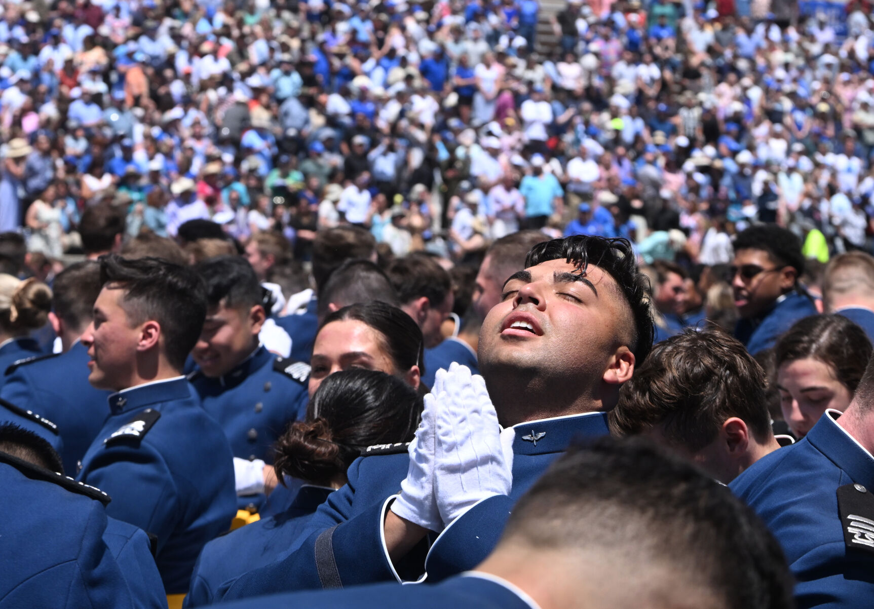 A cadet celebrates after receiving their diplomas during the Graduation Ceremony at Falcon Stadium at the Air Force Academy on Thursday, May 30, 2024. (Photo by Jerilee Bennett, The Gazette)
