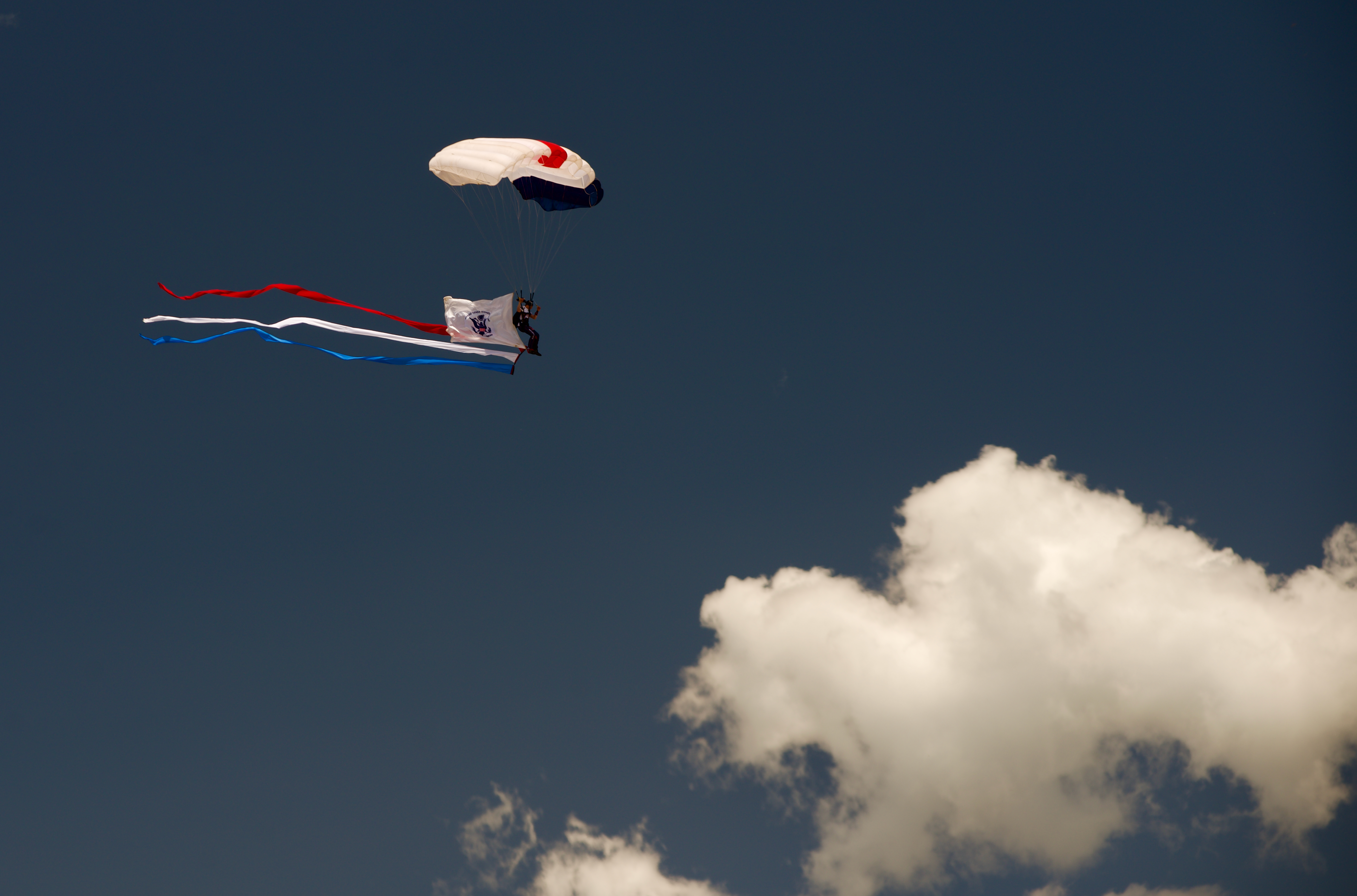 As part of Memorial Day celebrations in Boulder on May 27, 2024, a parachutist representing the United States Coast Guard leapt from an airplane carrying the services flag. All six branches of the United States military, Air Force, Army, Navy, Marine Corps, Coast Guard and Space Force, were represented. (Alex Edwards/The Denver Gazette) (AlexanderEdwardsBusiness Reporteralex.edwards@gazette.comhttps://secure.gravatar.com/avatar/dbaa50cc8a9183e280c297e3afa72ace?d=mm&r=g)