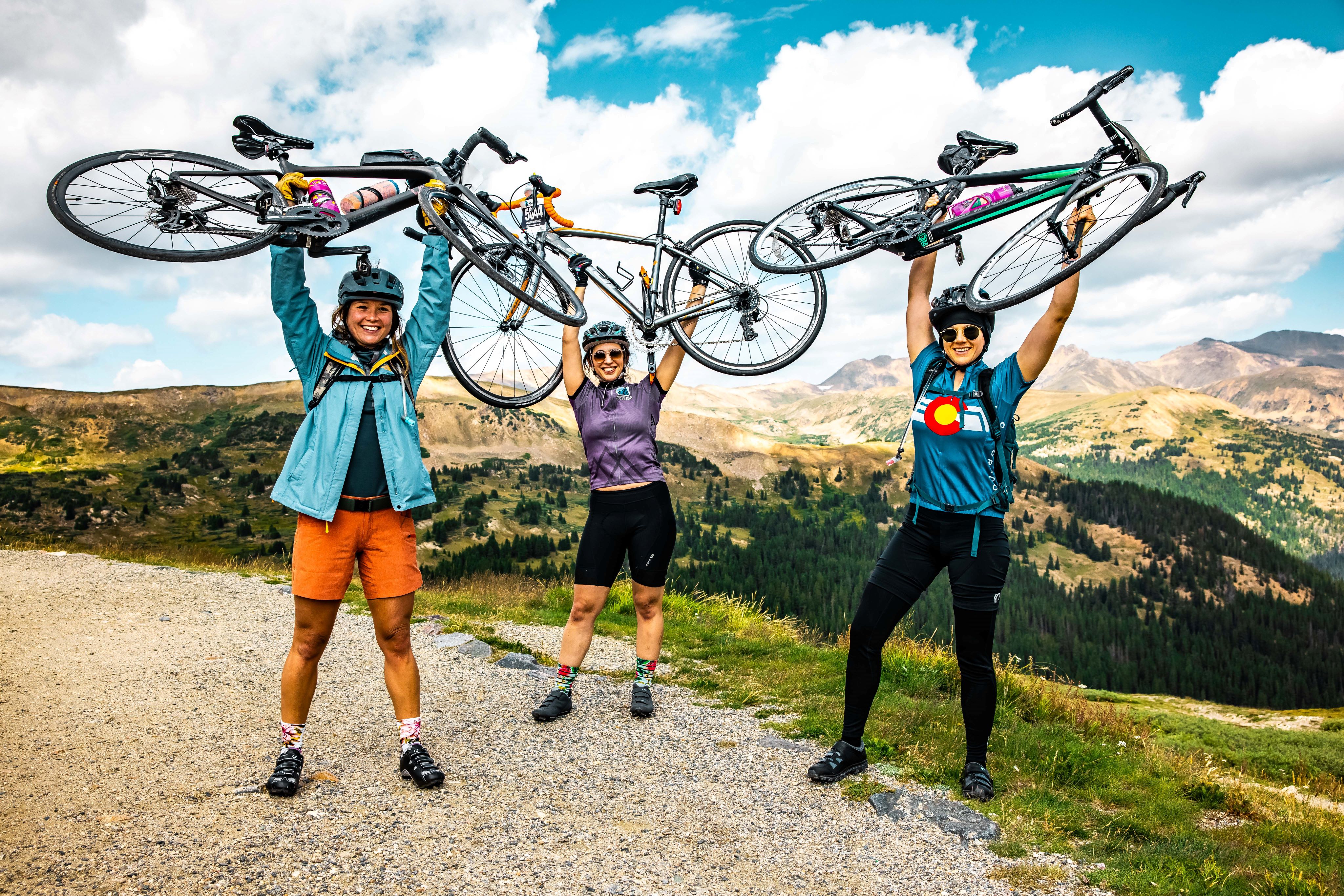 FILE PHOTO: Cyclists celebrate on top of a mountain pass during a Triple Bypass cycling event. (Courtesy photo, Matt Howshar/Triple Bypass)