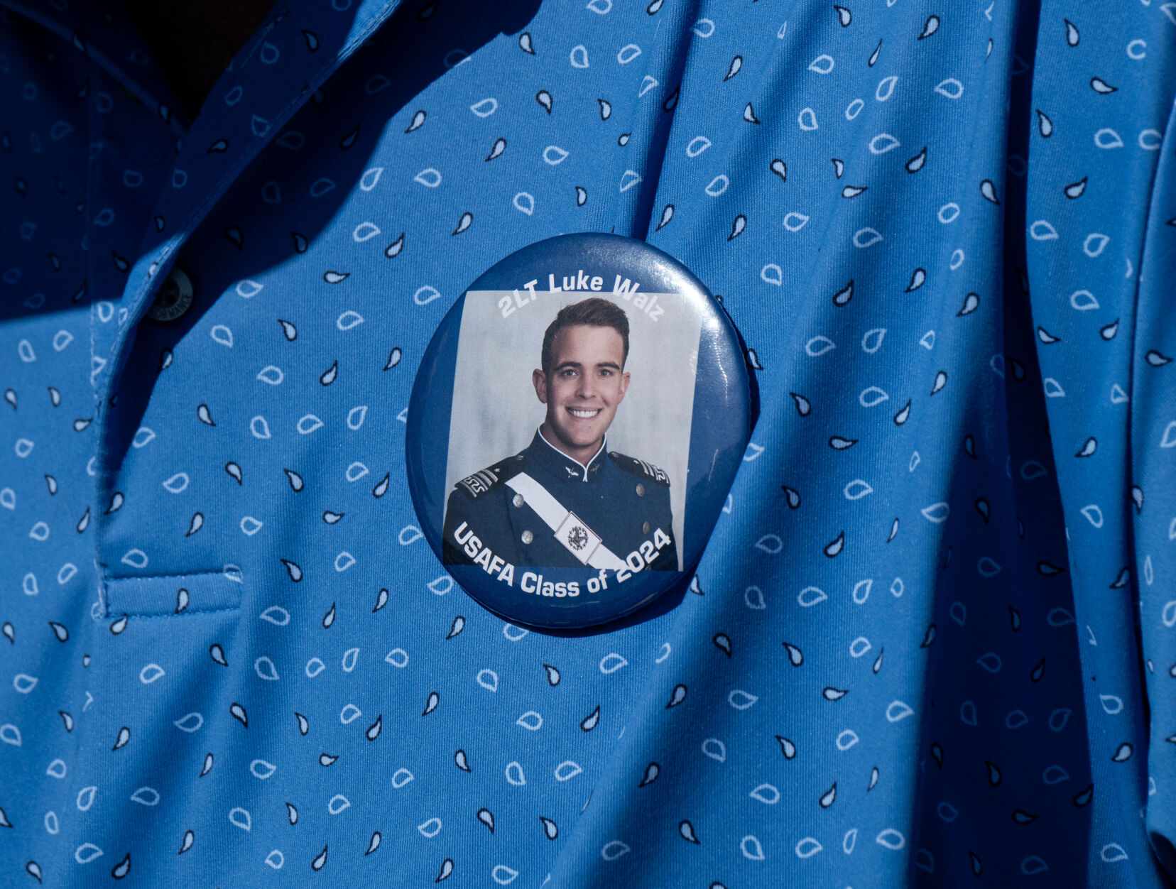 A family member of Air Force Academy graduate 2nd Lt. Luke Walz wears a pin with his photograph at the United States Air Force Academy graduation at Falcon Stadium on Thursday, May 30, 2024, in Colorado Springs, Colo. (Parker Seibold, The Gazette) (Parker Seibold)