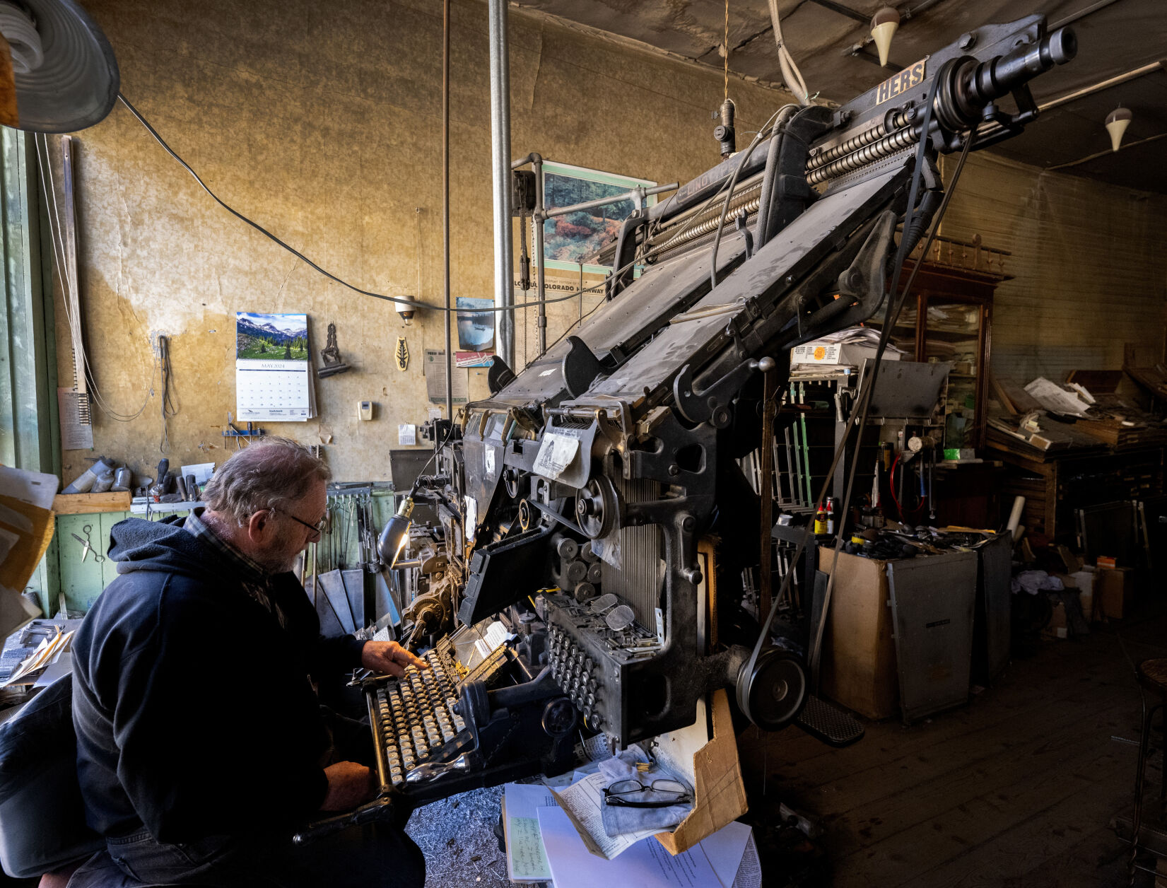 Facing extinction, a Colorado newspaperman and his machine press on
