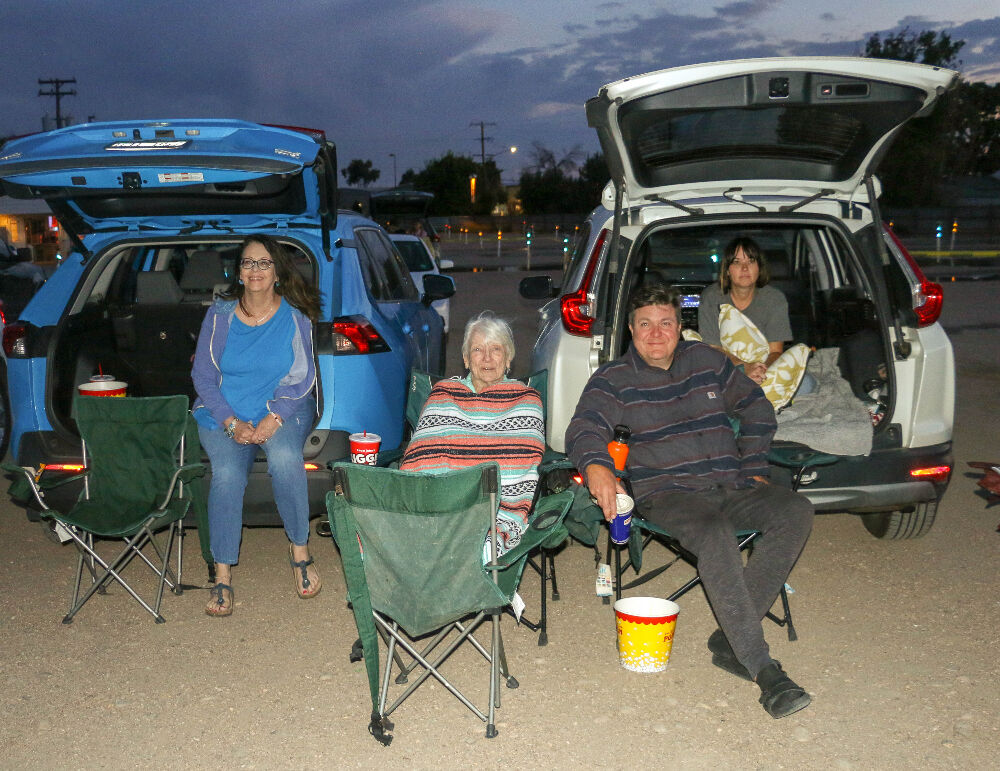 Drive-in enthusiasts, from left: Maura McCormack, Maureen Kennedy, Ricardo Baca and Melana Baca, Aug. 8, 2023, at The 88 Drive-in, which was said to be closing last summer but has returned for one more in Commerce City. (John Moore, Denver Gazette)