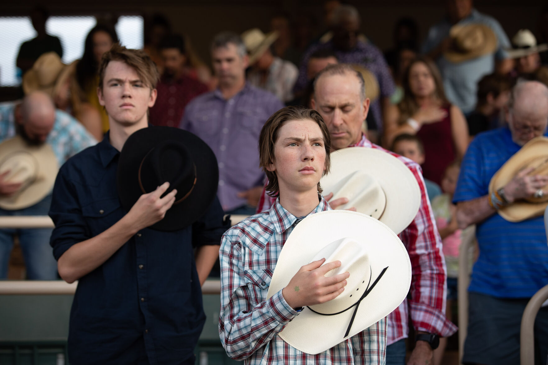 FILE - Folks take a moment of silence during the Star Spangled Banner at the Pikes Peak or Bust Rodeo on Wednesday, July 13, 2022. (John Stember/The Gazette)