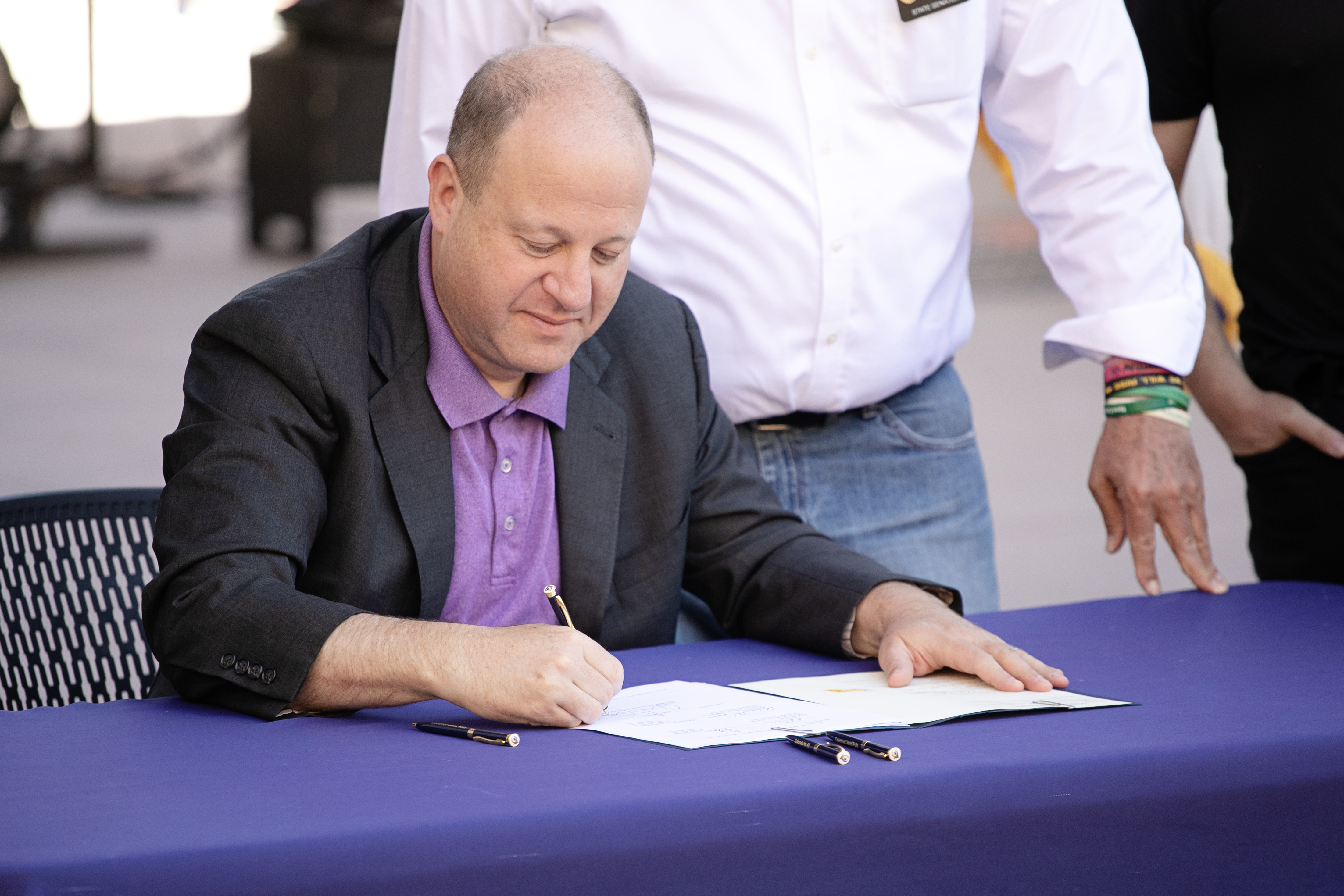 Gov. Jared Polis signs HB 24-1378 into law, a bill aimed at protecting concert ticket consumers, at Red Rocks Park and Amphitheatre prior to signing on Wednesday, June 5, 2024. (TomHellauerMultimedia Producertom.hellauer@denvergazette.comhttps://denvergazette.com/content/tncms/avatars/f/9e/622/f9e6228a-3b6b-11ed-bf10-fbb71fa8e421.f54b911252c540f1d61709edc4727a39.png)