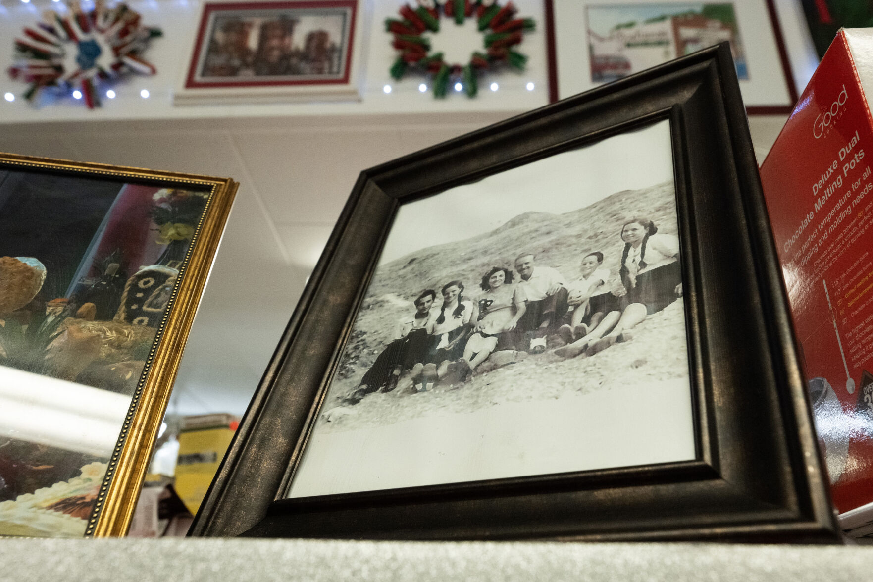 A picture sits on a shelf inside Gagliano's Italian Market & Deli shows the young Tony Gagliano, second from right, with his family in Italy before he and his father moved to Pueblo in the 1950s. (The Gazette, Christian Murdock) (Christian Murdock, The Gazette)