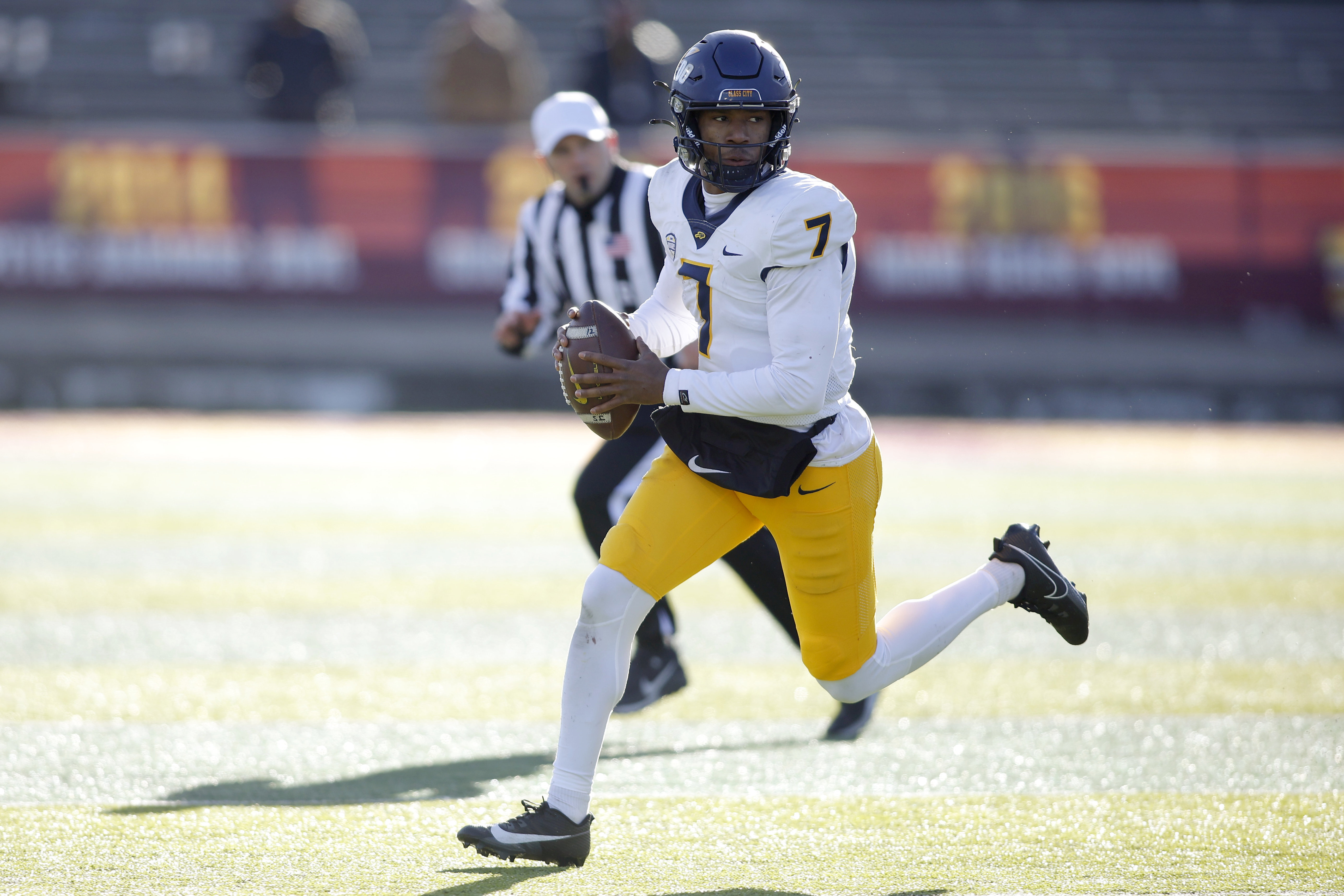 Toledo quarterback Dequan Finn (7) scrambles against Central Michigan during an NCAA college football game, Friday, Nov. 24, 2023, in Mount Pleasant, Mich. (AP Photo/Al Goldis) (Al Goldis)