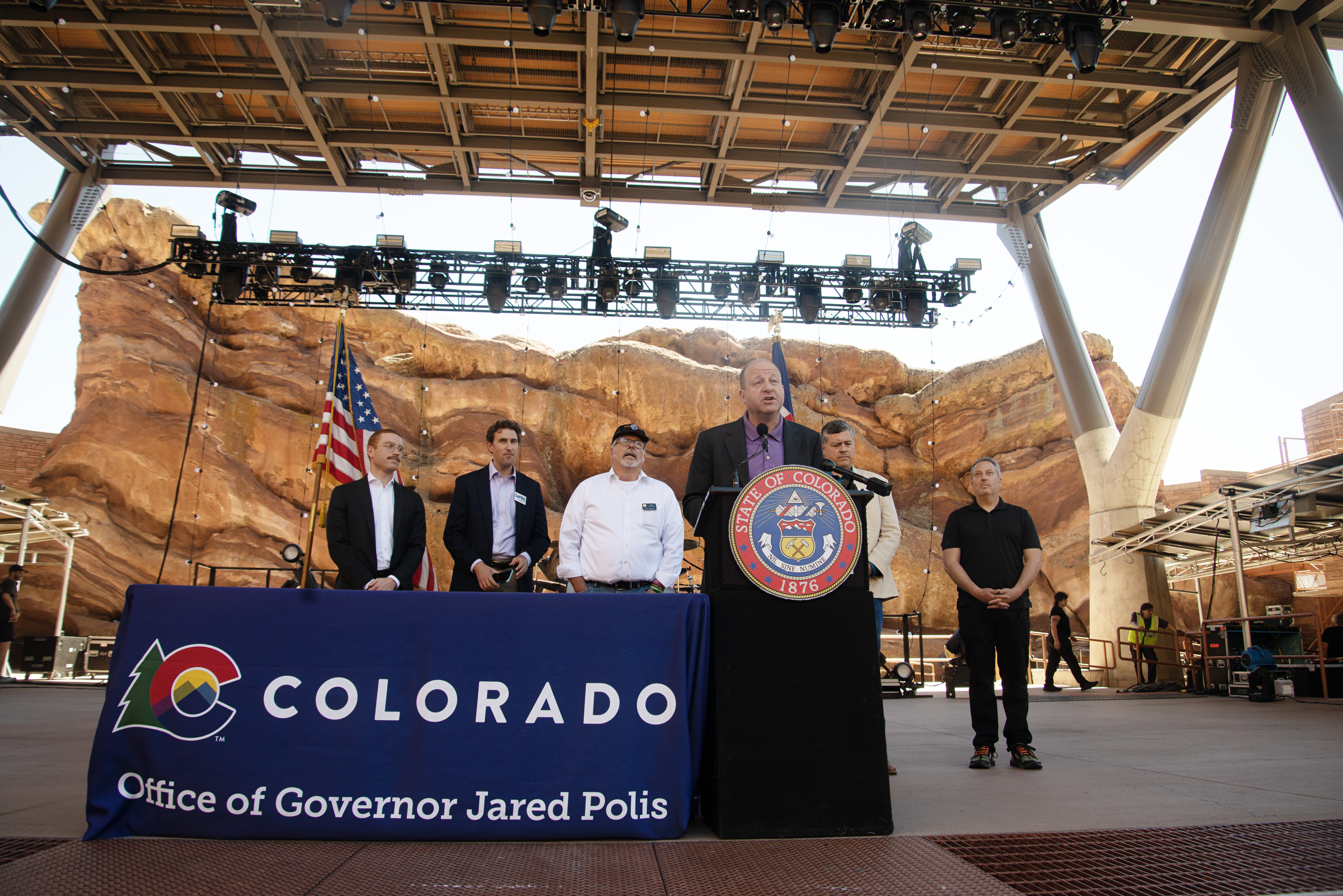 Gov. Jared Polis, front, addresses members of the media gathered at Red Rocks Park and Amphitheatre prior to signing HB 24-1378, a bill aimed at protecting concert ticket consumers, on Wednesday, June 5, 2024. (TomHellauerMultimedia Producertom.hellauer@denvergazette.comhttps://denvergazette.com/content/tncms/avatars/f/9e/622/f9e6228a-3b6b-11ed-bf10-fbb71fa8e421.f54b911252c540f1d61709edc4727a39.png)