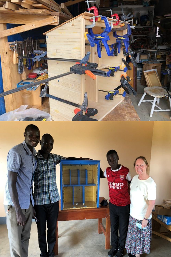 A little free library in Northern Uganda is pieced together with clamps and glue after flying across the ocean in a suitcase. (Courtesy photo, Russ Schnell)