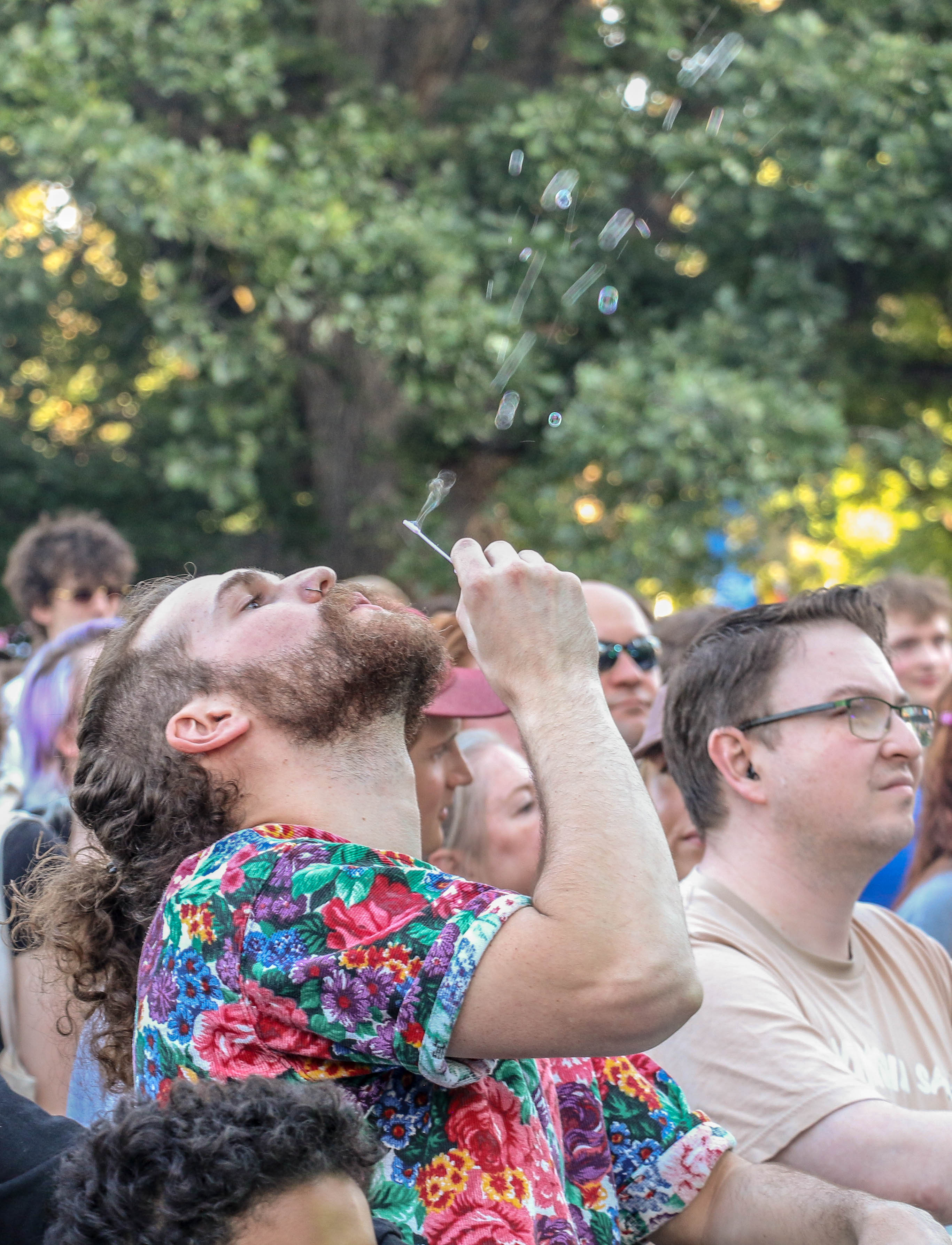 A bubble-blower enjoys Lettuce performing in Civic Center Park for the inaugural Outside Festival on Saturday, June 1, 2024. (John Moore, The Denver Gazette) (John Moore)