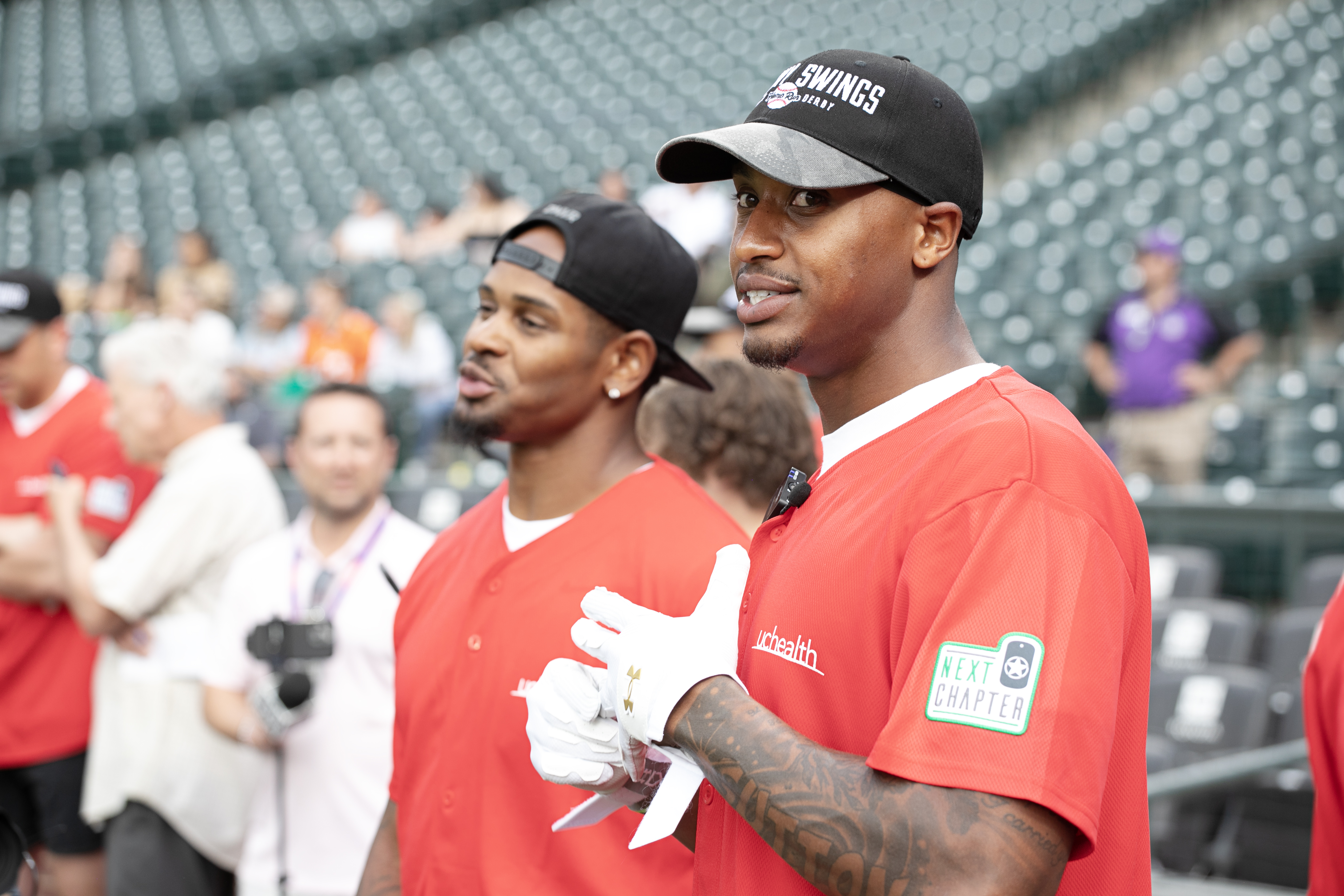 Former Denver Bronco Todd Davis, left, and Courtland Sutton watch other competitors in UCHealth's annual charitable home run derby 'Healthy Swings' at Coors Field on Wednesday, June 12, 2024. (TomHellauerMultimedia Producertom.hellauer@denvergazette.comhttps://denvergazette.com/content/tncms/avatars/f/9e/622/f9e6228a-3b6b-11ed-bf10-fbb71fa8e421.f54b911252c540f1d61709edc4727a39.png)