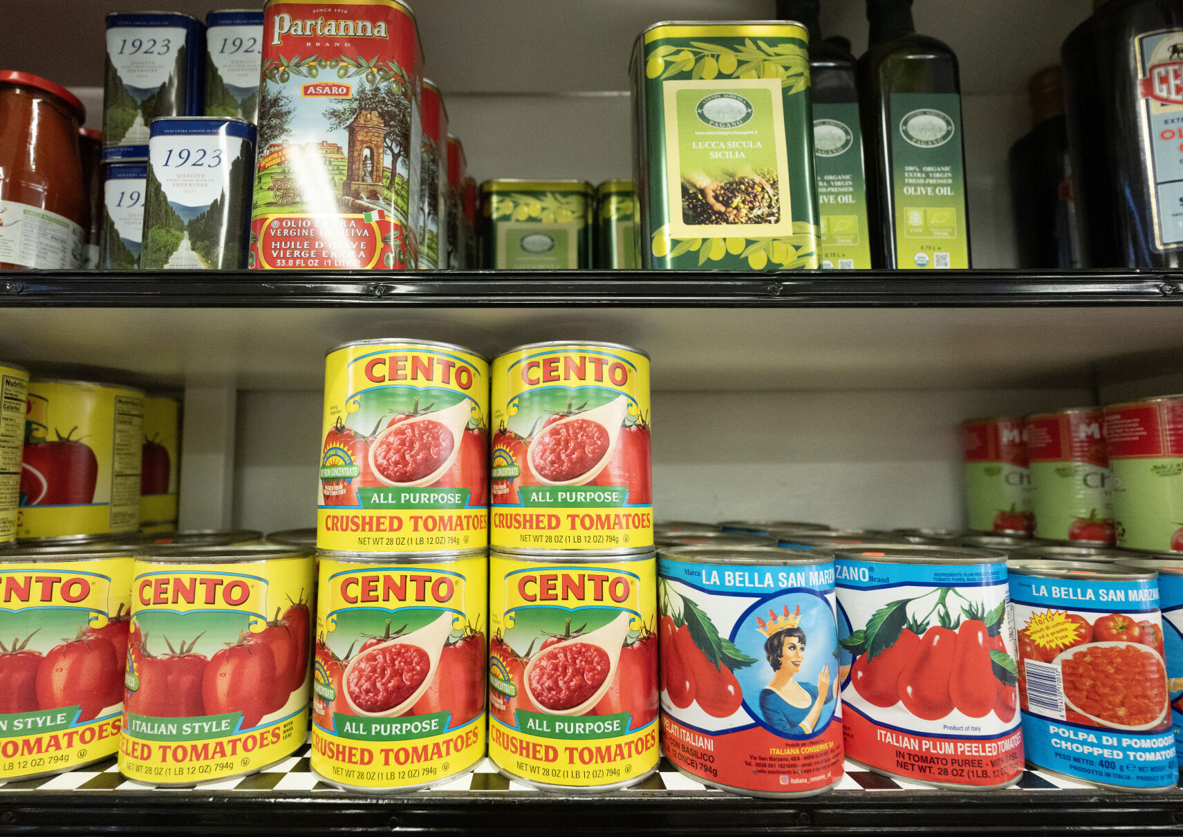 Everything Italian fills the shelves at Gagliano’s Italian Market & Deli in Pueblo including olive oil, top right, from Grandma Josephine’s family farm in Italy. (Christian Murdock, The Gazette)