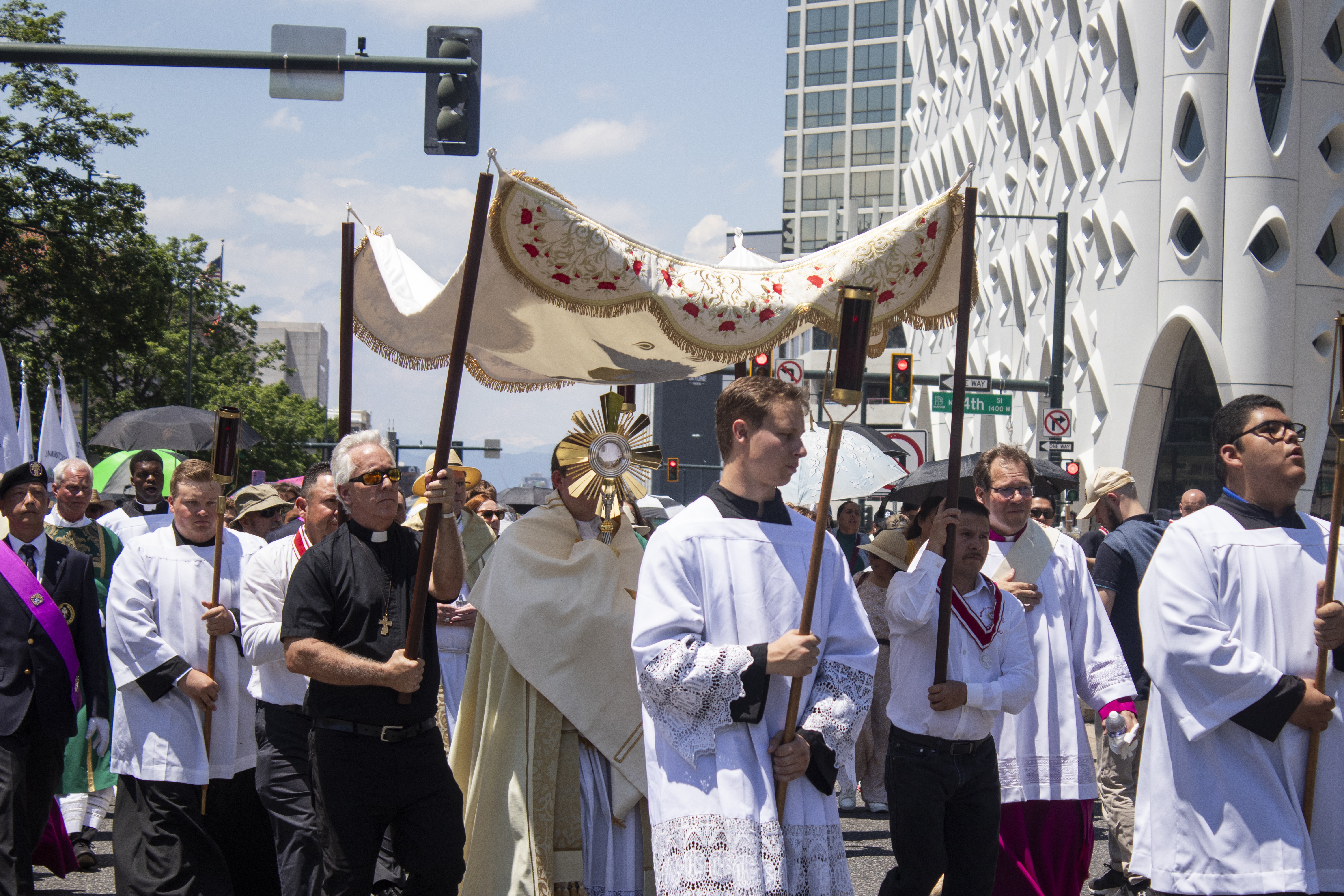 The Eucharistic procession around downtown Denver on Sunday, June 9, 2024 passing in front of the under-construction Populus Hotel. (Bernadette Berdychowski / Denver Gazette)