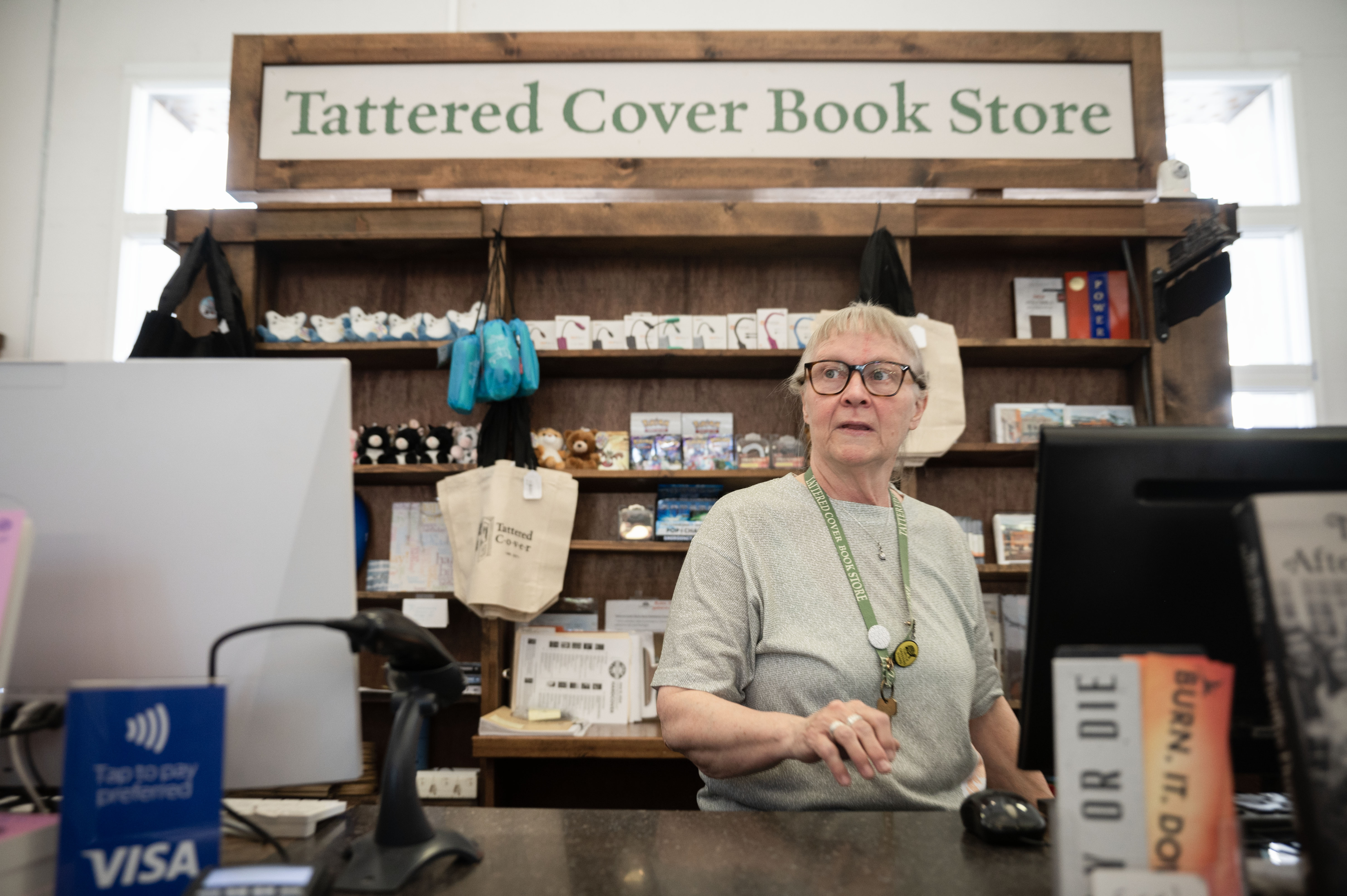 Ruth Bandy, Manager of the Tattered Cover Book Store at Union Station, helps customers during her shift on Thursday, June 13, 2024. “Walt Disney got it wrong,” Bandy said, “He doesn’t have the happiest place on earth. I do.” The owners of Tattered Cover are considering a bid from Barnes & Noble which could end the chain’s legacy as an independently-owned bookstore. (Stephen Swofford, Denver Gazette) (StephenSwoffordPhotographerstephen.swofford@gazette.comhttps://secure.gravatar.com/avatar/1ddcaf11c5d70eaa58546ddc4e038687?d=mm&r=g)