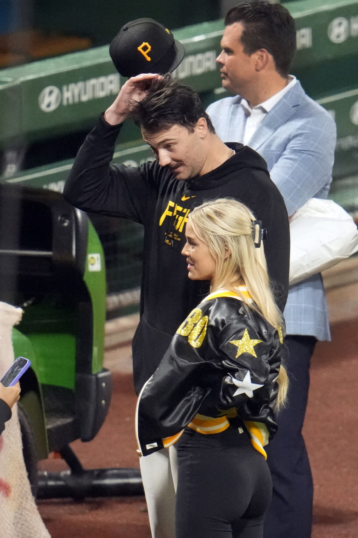 Pittsburgh Pirates starting pitcher Paul Skenes and girlfriend Livvy Duane visit with family and friends after Skenes made his Major League debut against the Chicago Cubs in Pittsburgh on May 11. (the associated press)
