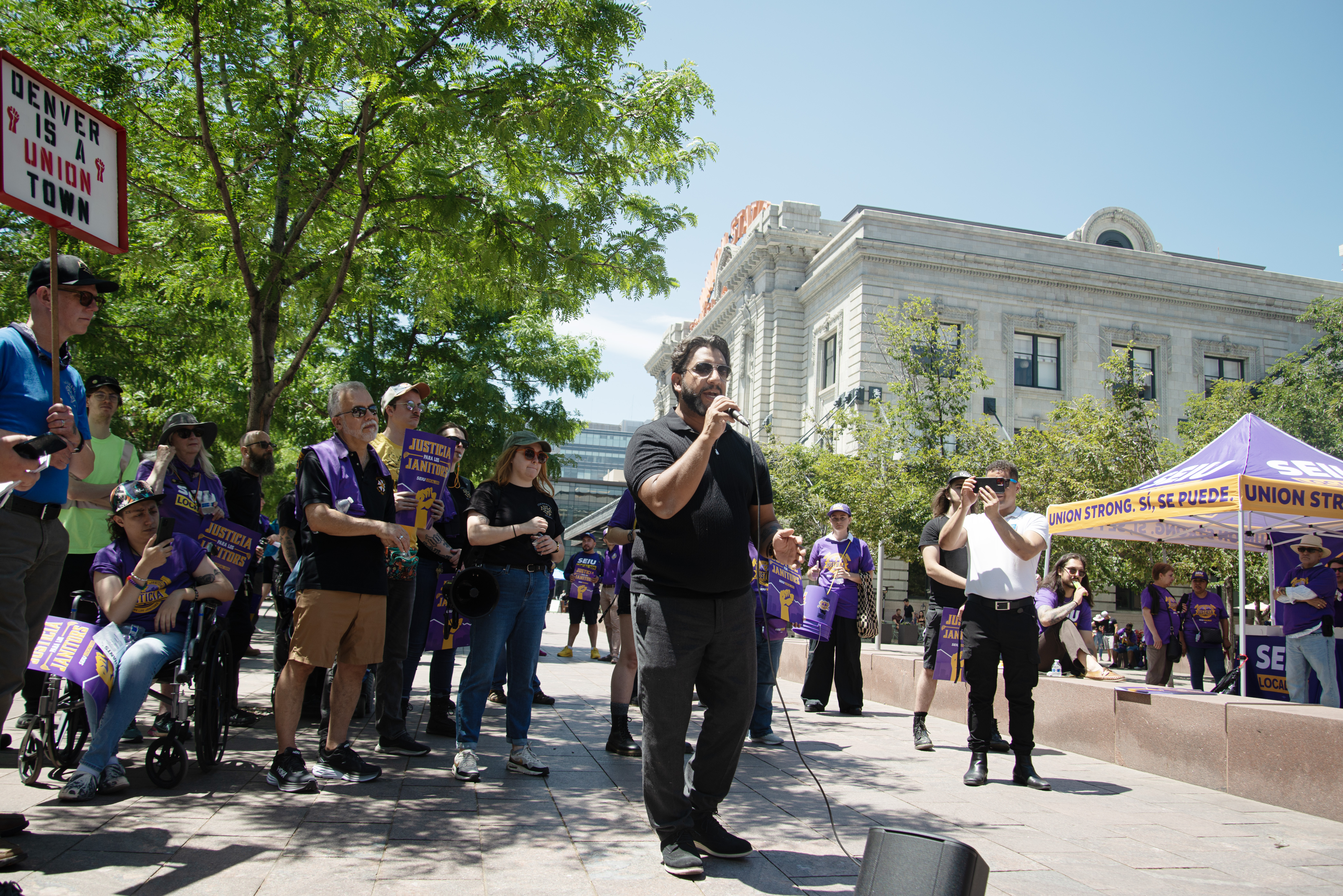 Denver Clerk and Recorder Paul López addresses member of the Service Employees International Union (SEIU) Local 105 during a 