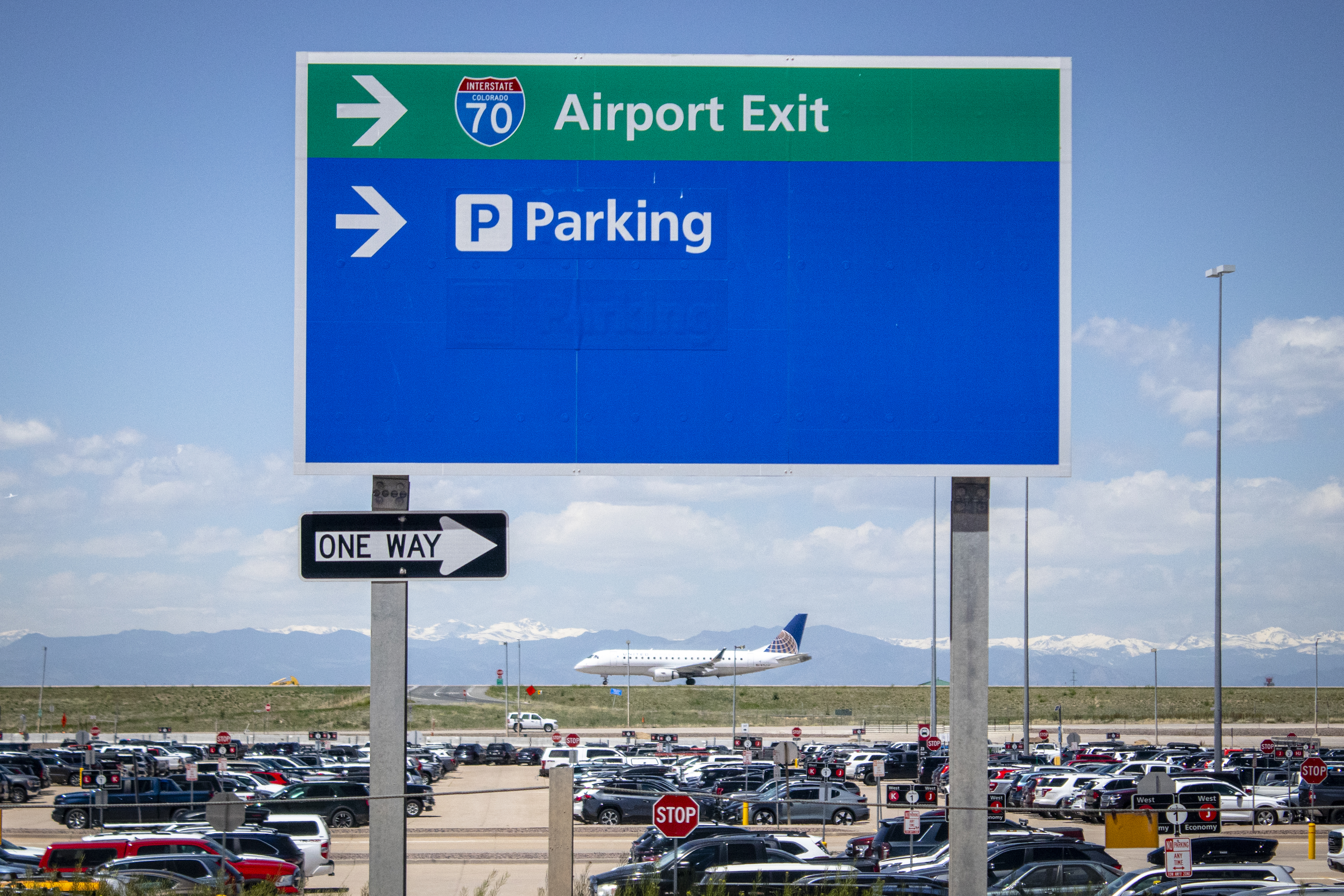 A plane lines up on a Denver International Airport runway for take off on May 23, 2024. The empty land surrounding the airport is being primed to become an 