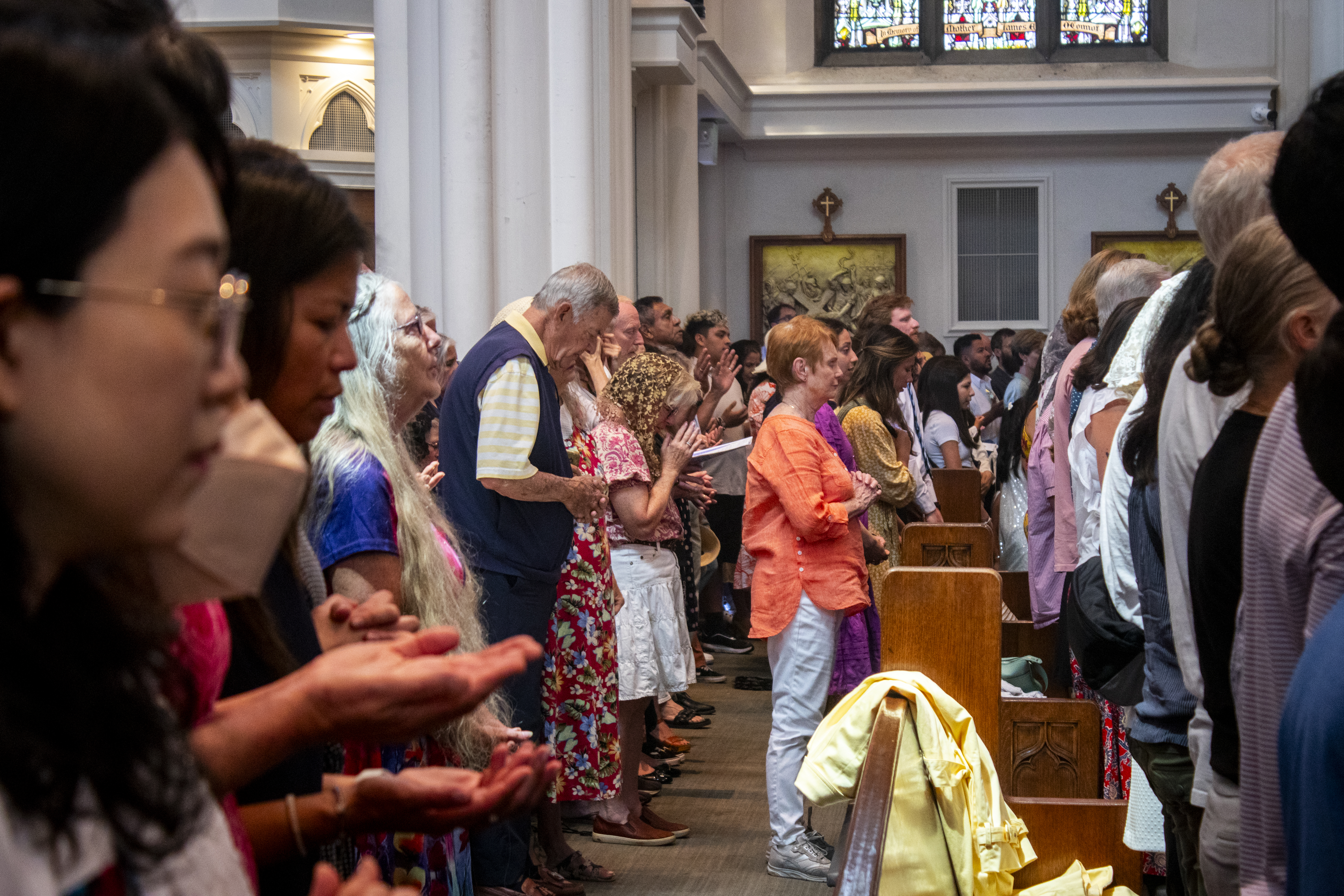 Mass attendees worship at the Cathedral Basilica of the Immaculate Conception on Sunday, June 9, 2024 before a procession of the Eucharist around downtown Denver. (Bernadette Berdychowski / Denver Gazette)