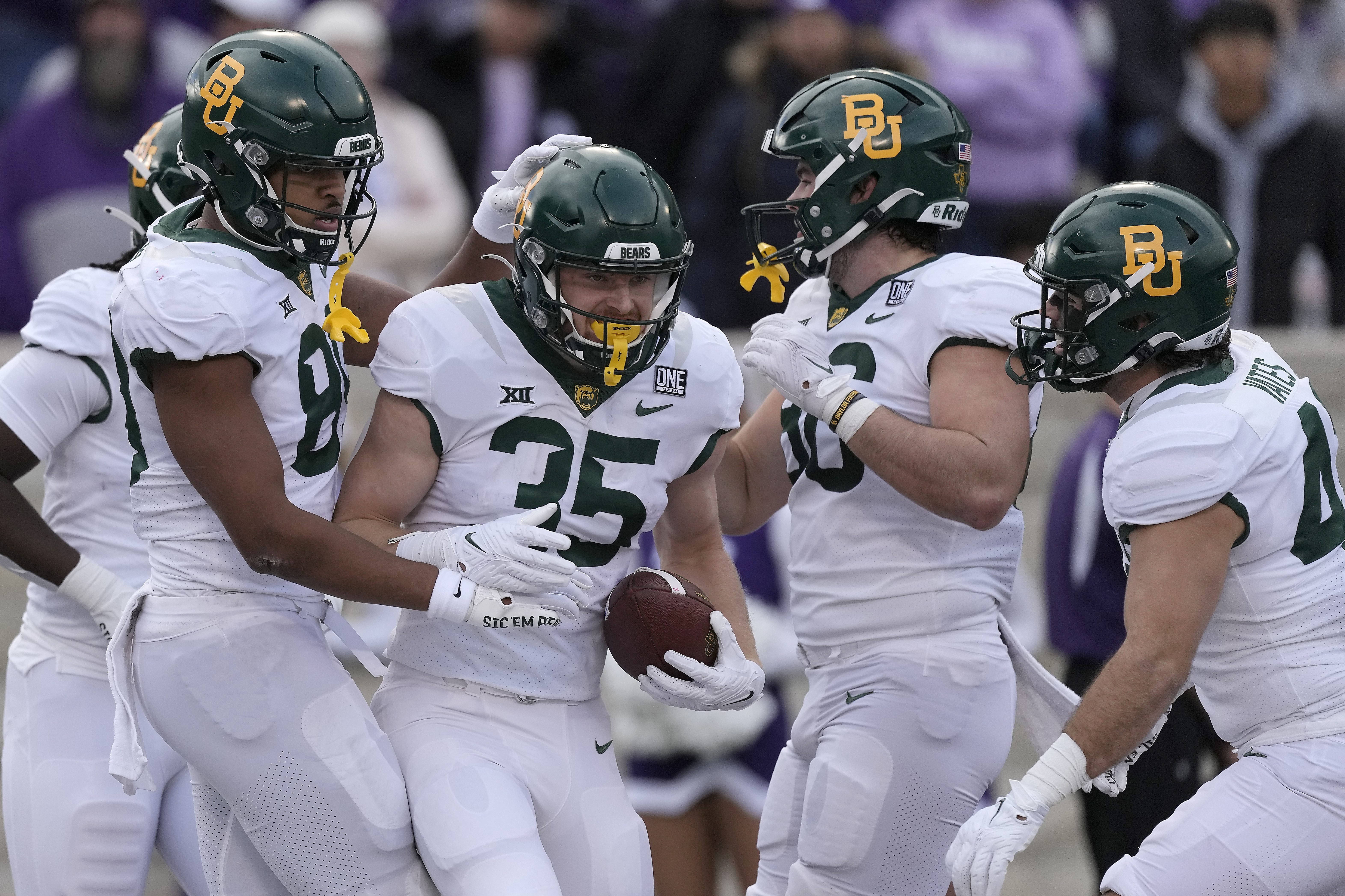 Baylor running back Dawson Pendergrass (35) celebrates with teammates after scoring a touchdown during the first half of an NCAA college football game against Kansas State Saturday, Nov. 11, 2023, in Manhattan, Kan. (AP Photo/Charlie Riedel) (Charlie Riedel)