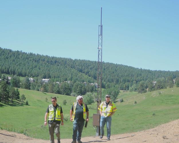 Project managers in front of wildlife cameras