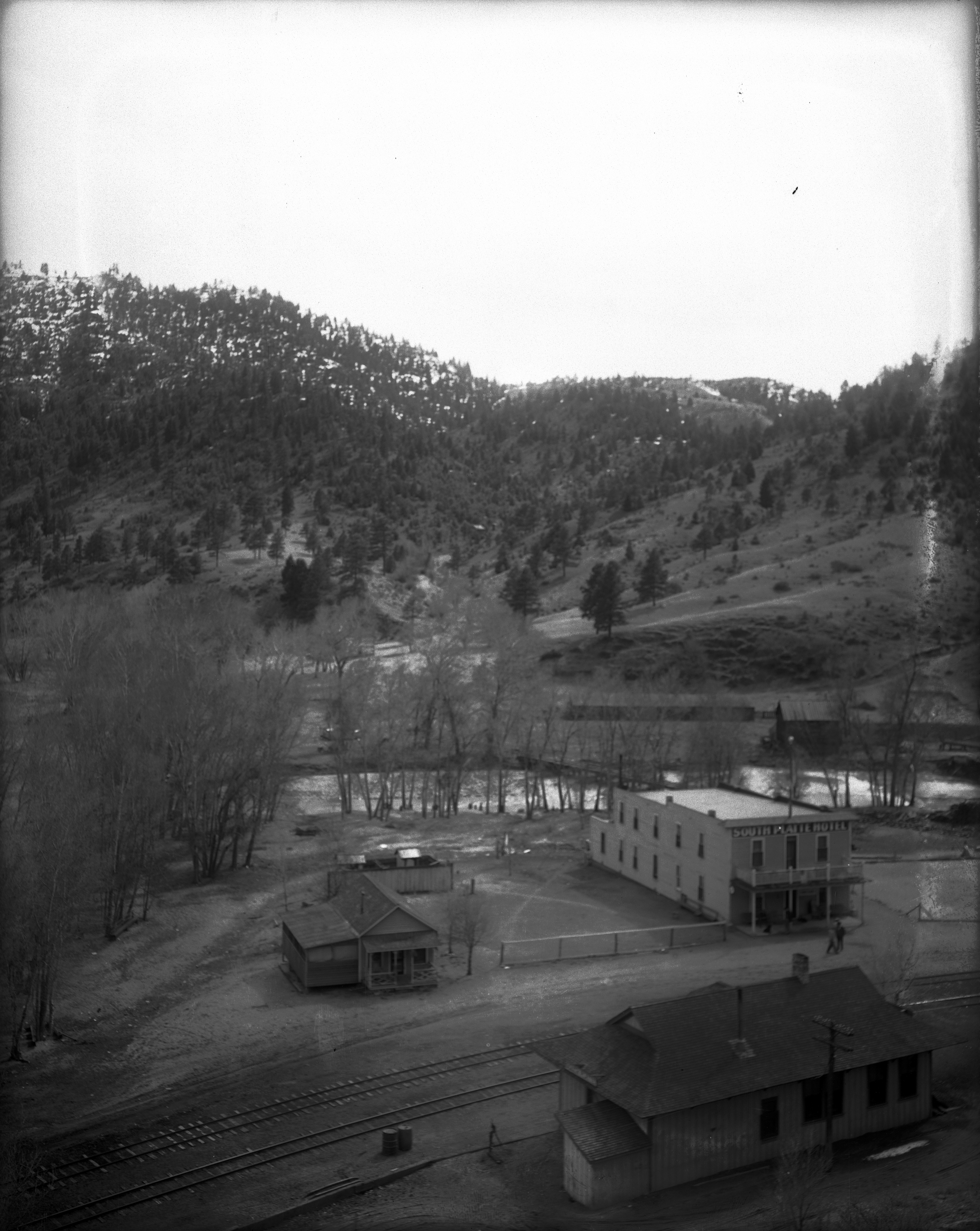The South Platte Hotel as pictured in the early 1900s, (upper right building) was once a major driver of tourism in Jefferson County, welcoming weary stagecoach and narrow gauge train passengers. Now, more than a century later, local history preservationists want to rescue the deteriorating structure and explore options for adaptive re-use.View overlooking the Colorado & Southern Railway depot and tracks, South Platte (also known as Symes), Jefferson County, Colorado, includes . (Courtesy photo, Denver Public Library Special Collections, X-13616.)