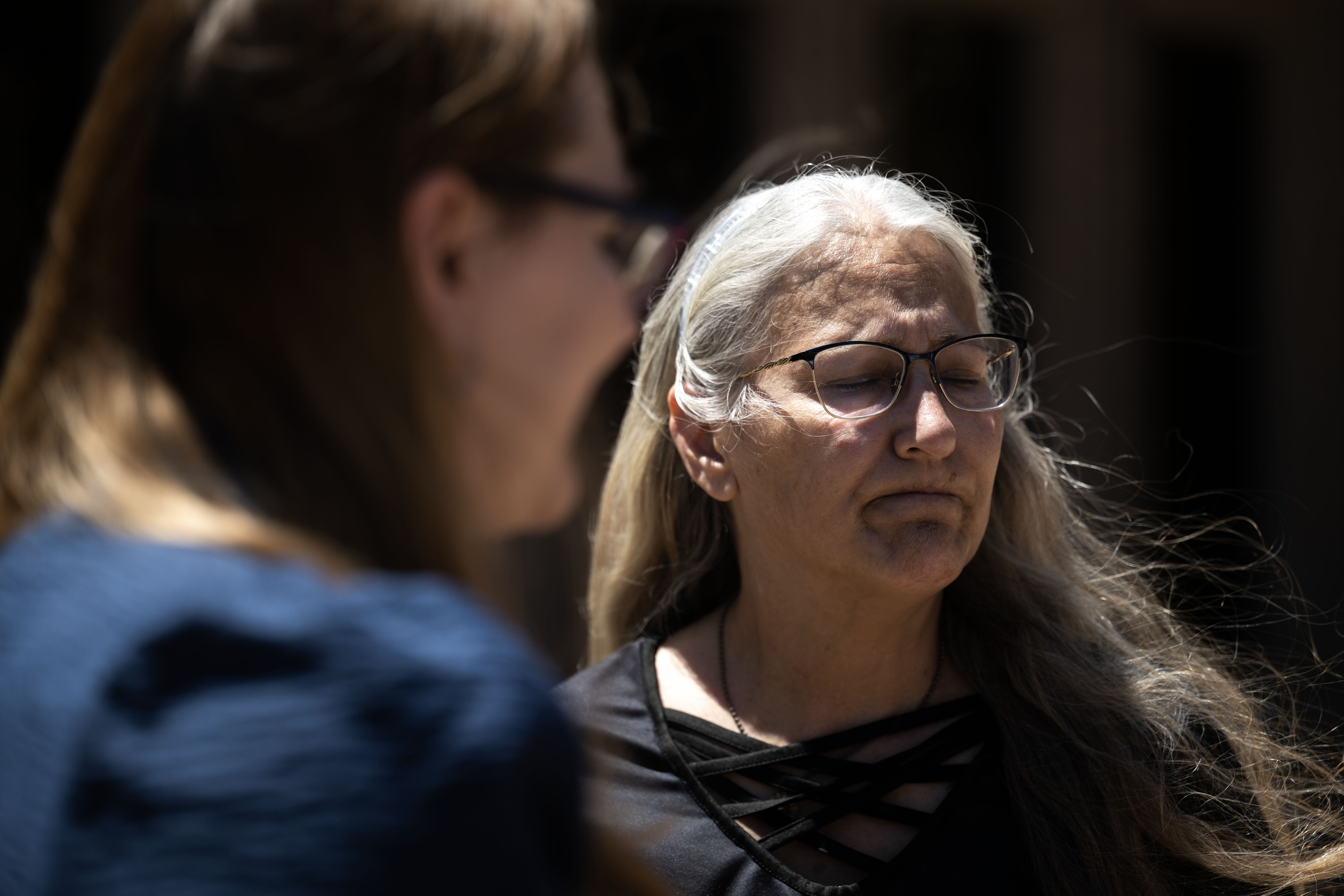 Kathy Eppler, left, sister of Kelly Sloat-White, talks with reporters outside the courthouse with her daughter Samantha Van Laethem after Garrett Coughlin pleaded guilty to second-degree murder for triple homicide. Coughlin was sentenced to 42 years with the possibility of parole after 24 years. (Stephen Swofford, The Gazette)