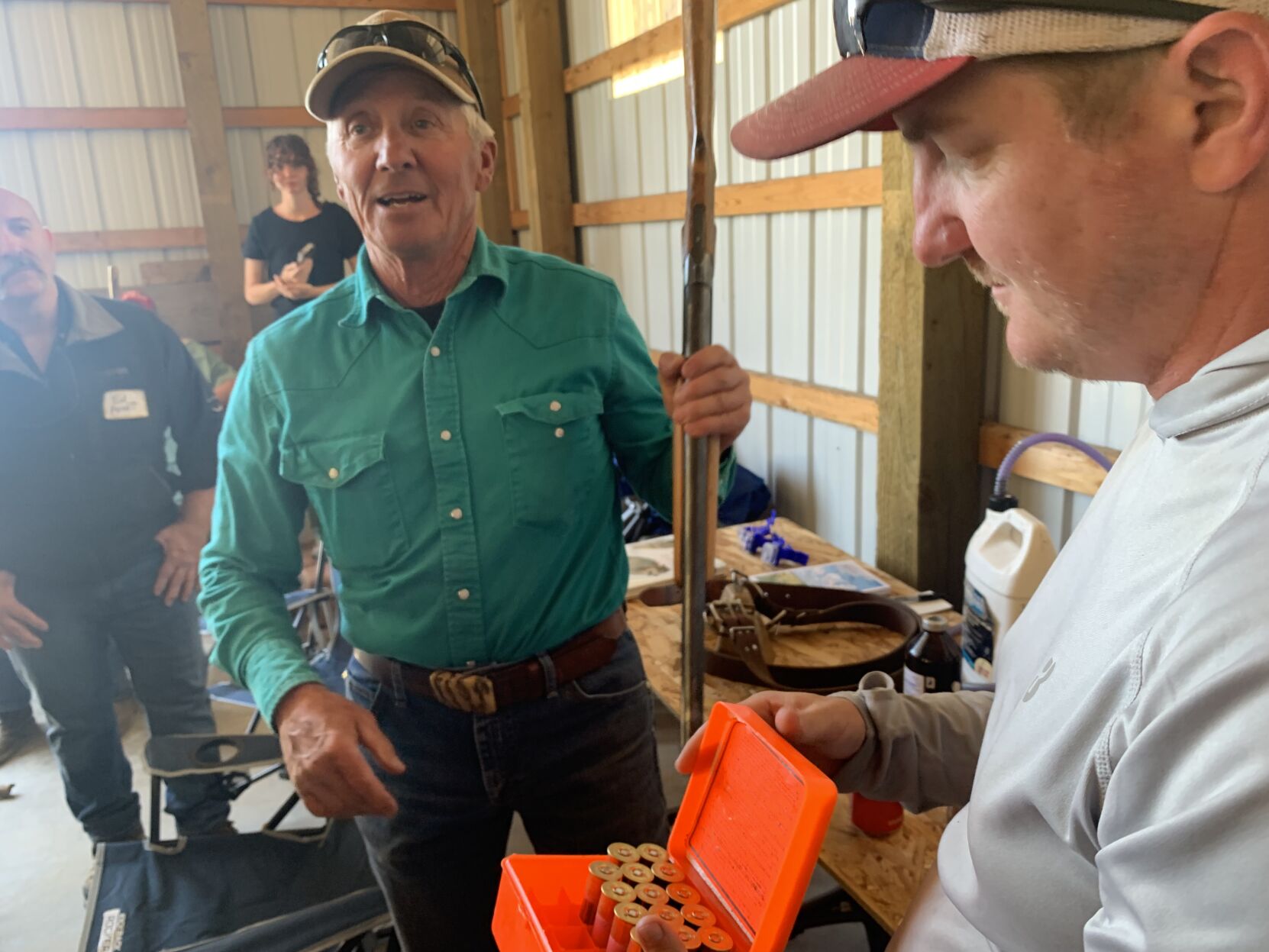 Don and Lee Gittleson with a shotgun and 