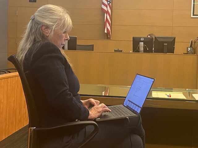 Eleventh Judicial District Attorney Linda Stanley sits in a Denver District courtroom during the first day of her ethics hearing. Her hearing, overseen by the Office of Attorney Regulation Counsel, is expected to last two weeks. (Carol McKinley/Denver Gazette)