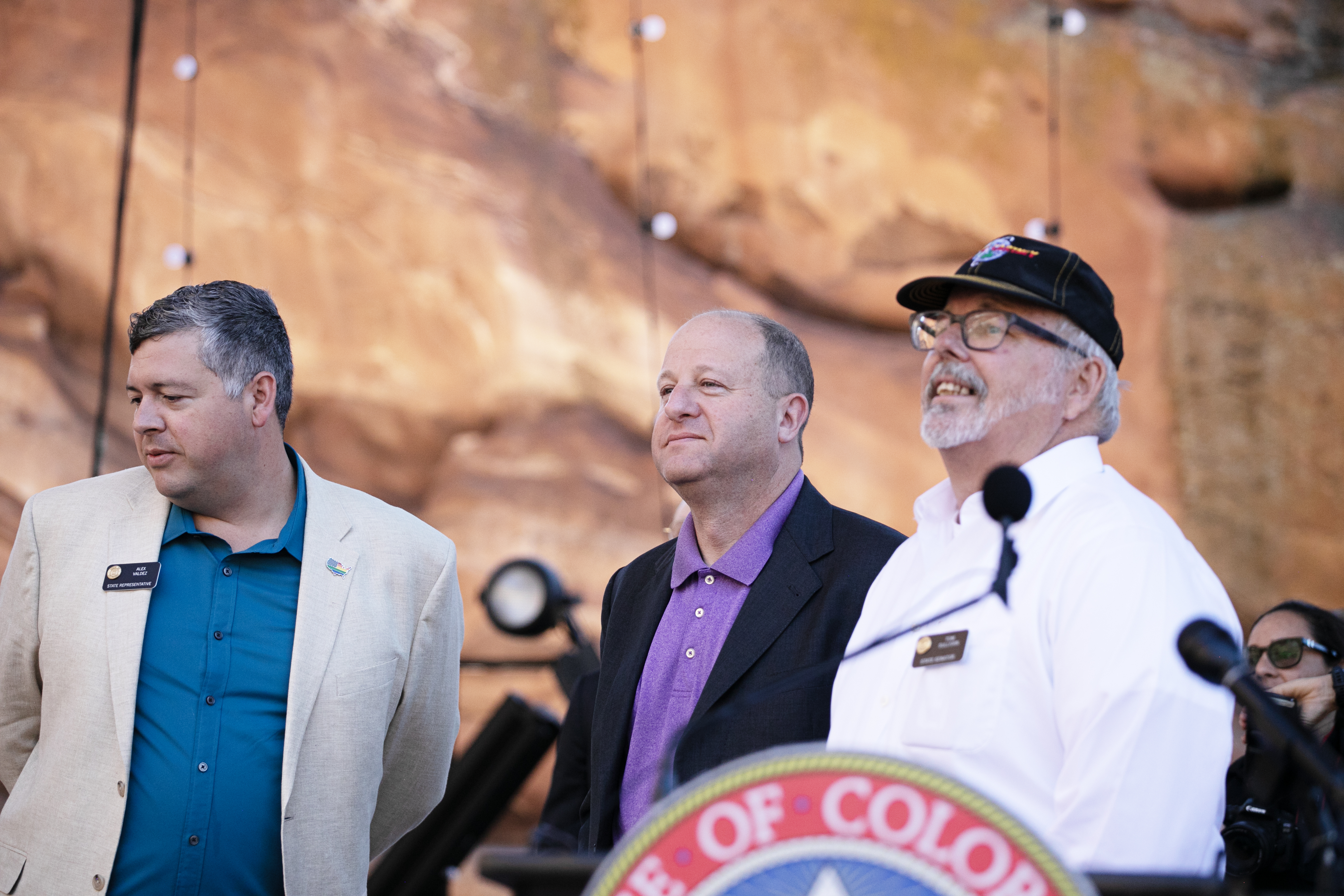 From left, Rep. Tom Valdez, Gov. Jared Polis and Sen. Tom Sullivan, address members of the media gathered at Red Rocks Park and Amphitheatre prior to signing HB 24-1378, a bill aimed at protecting concert ticket consumers, on Wednesday, June 5, 2024. (TomHellauerMultimedia Producertom.hellauer@denvergazette.comhttps://denvergazette.com/content/tncms/avatars/f/9e/622/f9e6228a-3b6b-11ed-bf10-fbb71fa8e421.f54b911252c540f1d61709edc4727a39.png)