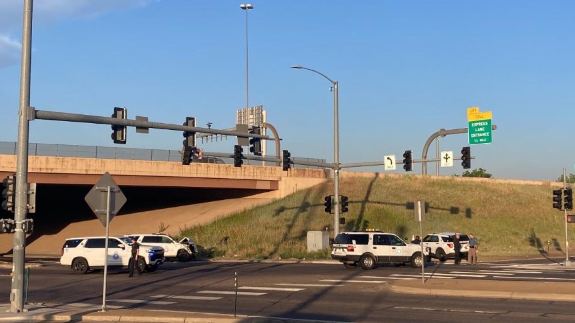 Denver Police milling around the area a car pursuit ended after a shooting in Aurora. (Anna Hewson/9NEWS) (Credit: Anna Hewson/9NEWS)