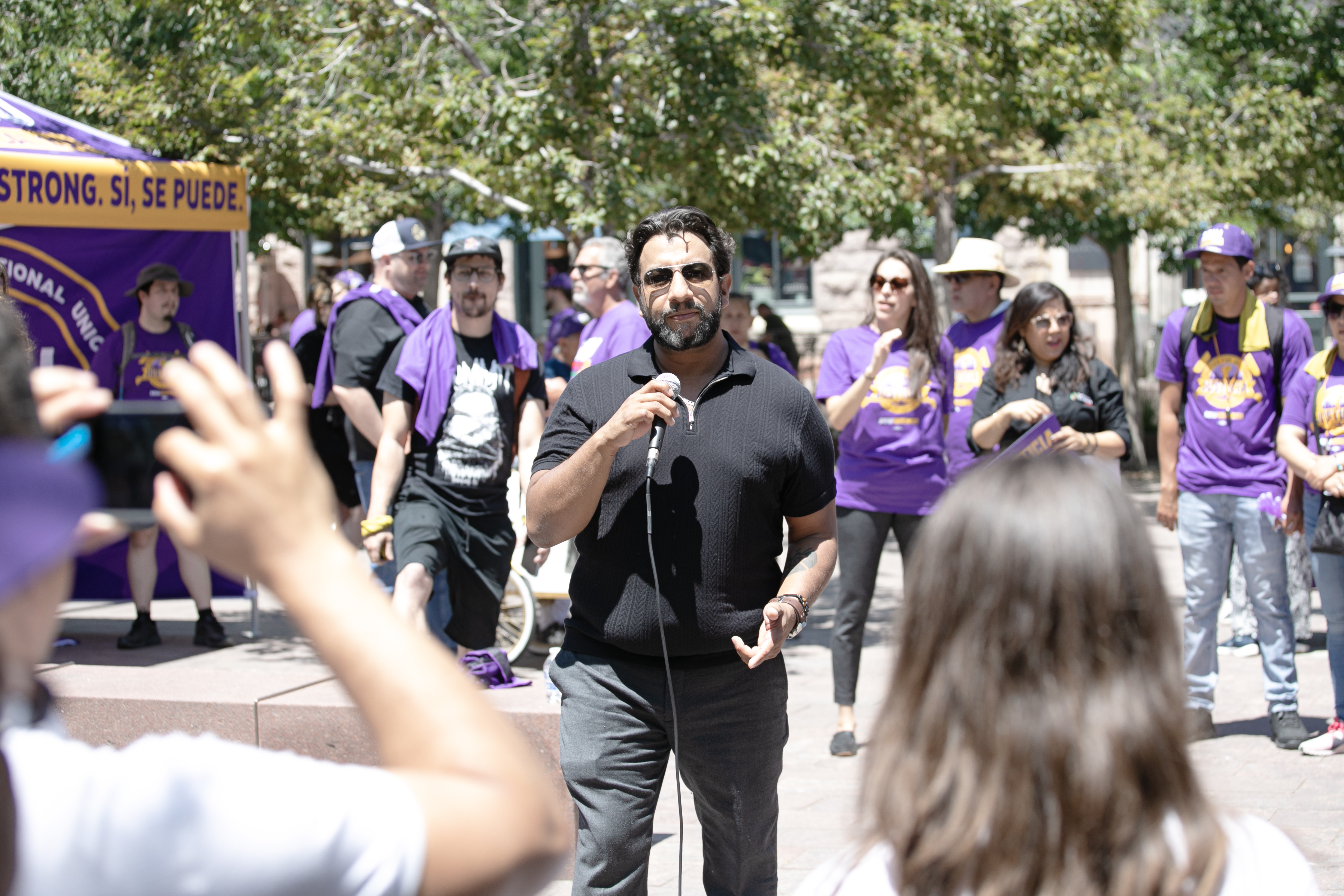 Denver Clerk and Recorder Paul López addresses member of the Service Employees International Union (SEIU) Local 105 during a 