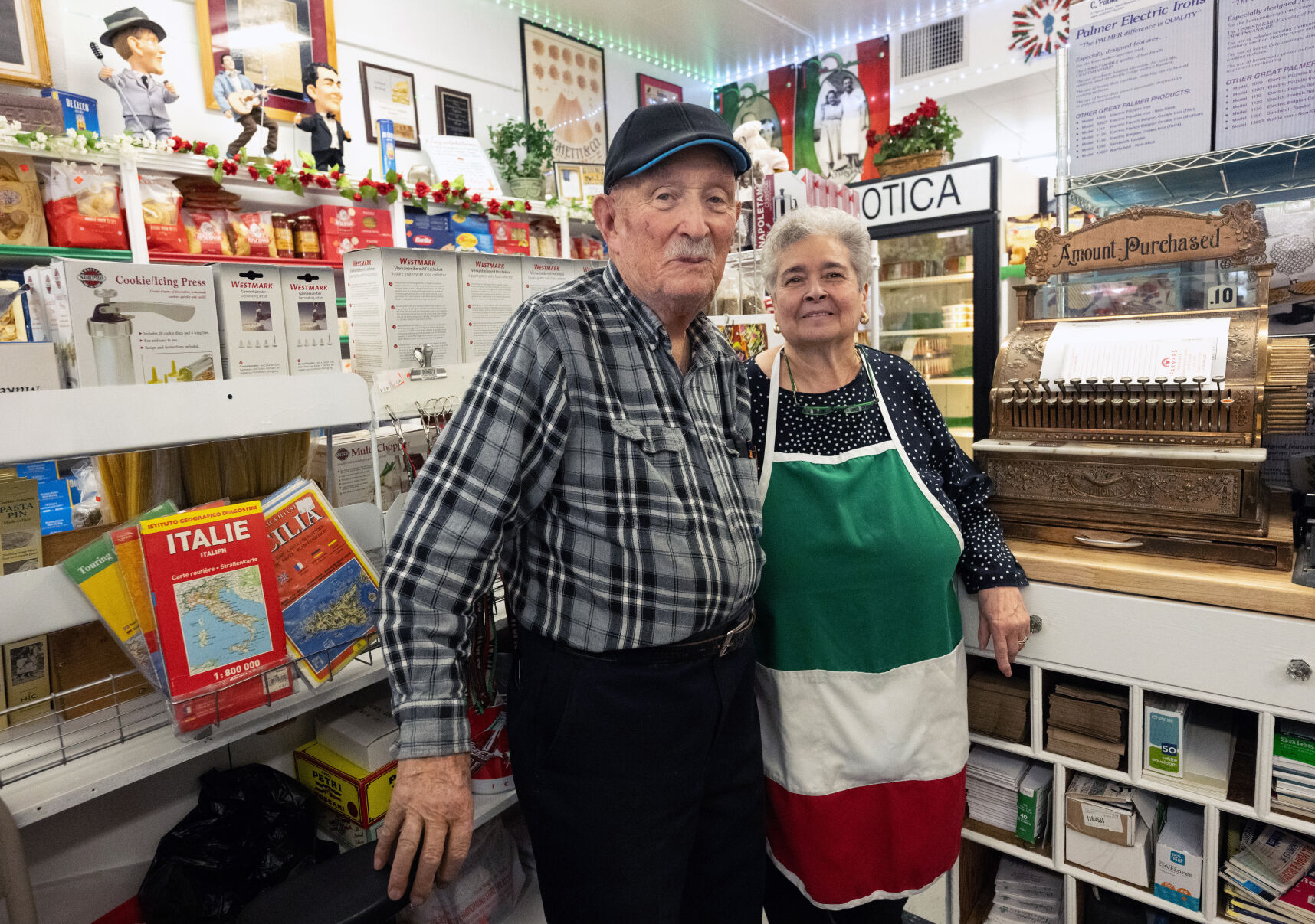 TOP: Tony and Josephine Gagliano pose behind the counter of their market in Pueblo. ABOVE: The Muffaletta sandwich is photographed at Gagliano’s Italian Market and Deli. (photos by Christian Murdock, The Denver Gazette)