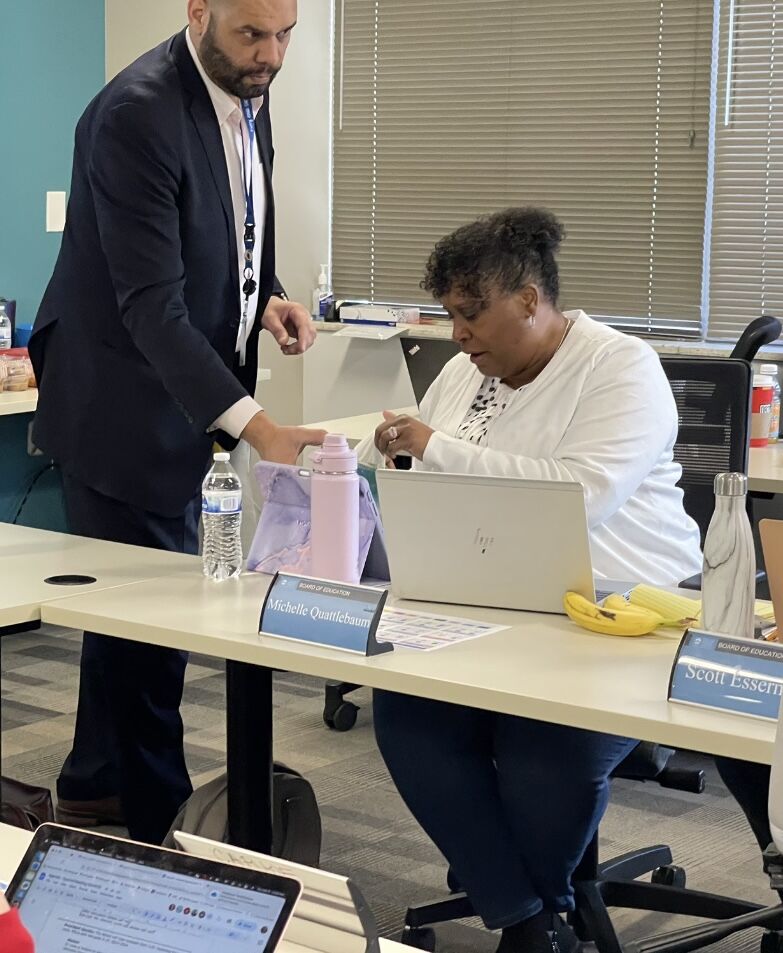 FILE PHOTO: General Counsel Aaron Thompson provides a tissue to Denver Public Schools Board of Education Director Michelle Quattlebaum on March 9, 2023 during a board meeting in which members voted to close school schools. (NicoBrambilanico.brambila@denvergazette.comhttps://denvergazette.com/content/tncms/avatars/4/ec/74a/4ec74aa2-71b0-11ed-af6f-0f0ae7acf7b0.d52fca74e95503d77da50127c9ff4e2d.png)