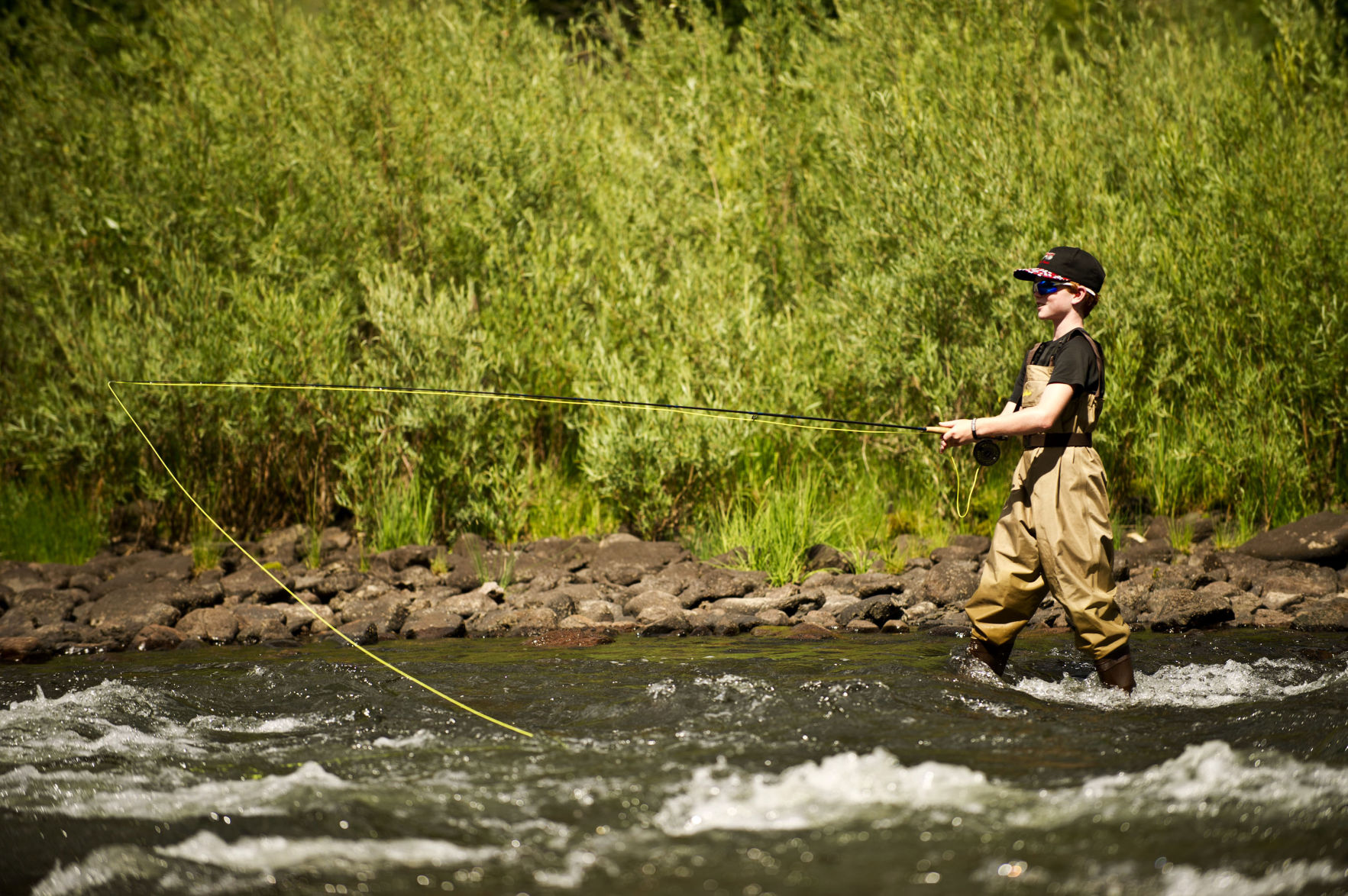 SUSANNAH KAY, THE GAZETTESam Langenbahn, 10, fly fishes for trout in the Rio Grande River while visiting family at their vacation home in Creede, Colo., on Thursday, July 26, 2012. Photo by Susannah Kay, The Gazettey (SUSANNAH KAY, THE GAZETTE)