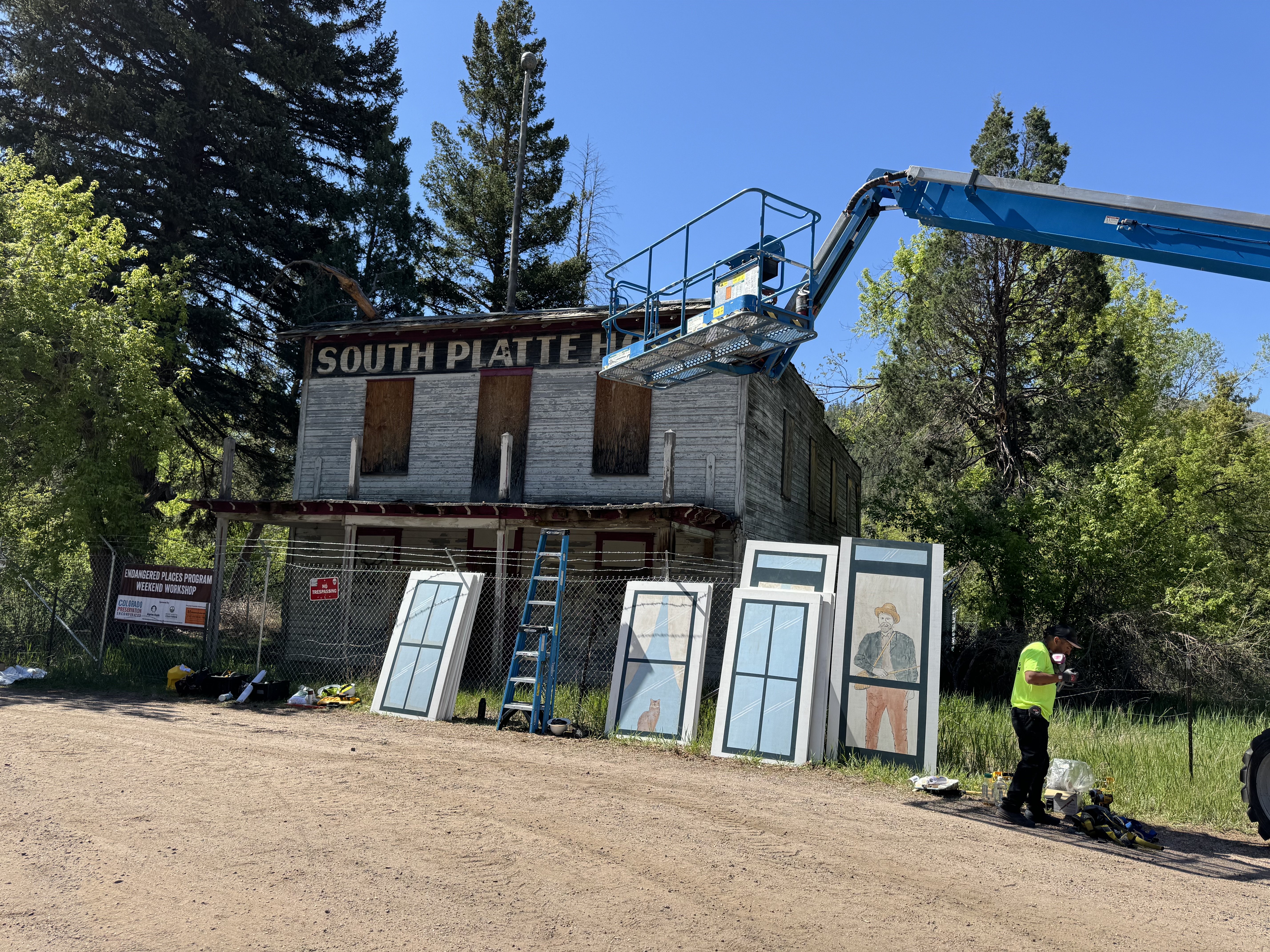 In May, volunteers sponsored by Colorado Preservation, Inc. installed 27 decorative plywood panels on the deteriorating facade of the South Platte Hotel in Jefferson County. (Courtesy photo, Colorado Preservation, Inc.)
