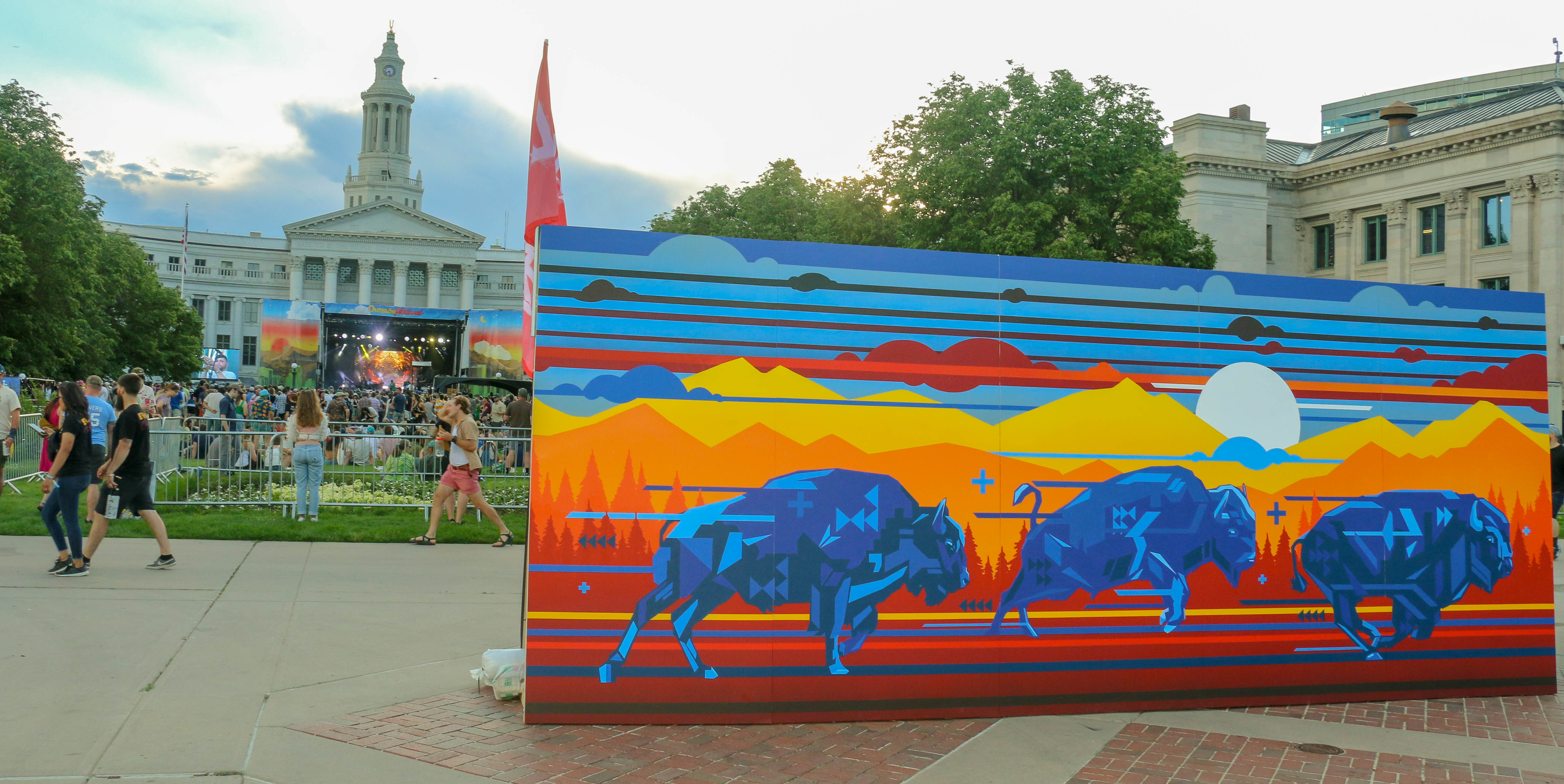 A mural by Jaycee Beyale and Anthony Garcia greets music fans in Civic Center Park for the inaugural Outside Festival on Saturday, June 1, 2024. The mural seeks to portray the interconnectedness of land, sky and water. (John Moore, The Denver Gazette) (John Moore)