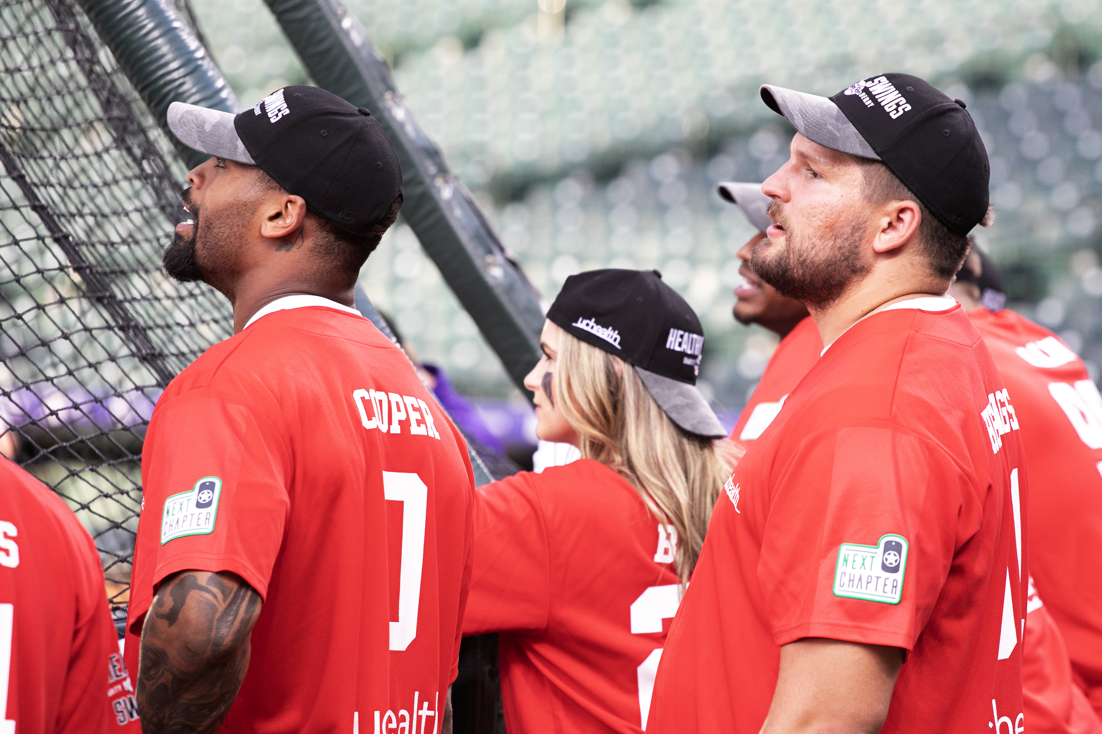 Denver Broncos players, Jonathon Cooper, left, and Matt Henningsen, right, watch fellow Broncos participate in the UCHealth 'Healthy Swings' home run derby for charity at Coors Field on Wednesday, June 12, 2024. (TomHellauerMultimedia Producertom.hellauer@denvergazette.comhttps://denvergazette.com/content/tncms/avatars/f/9e/622/f9e6228a-3b6b-11ed-bf10-fbb71fa8e421.f54b911252c540f1d61709edc4727a39.png)