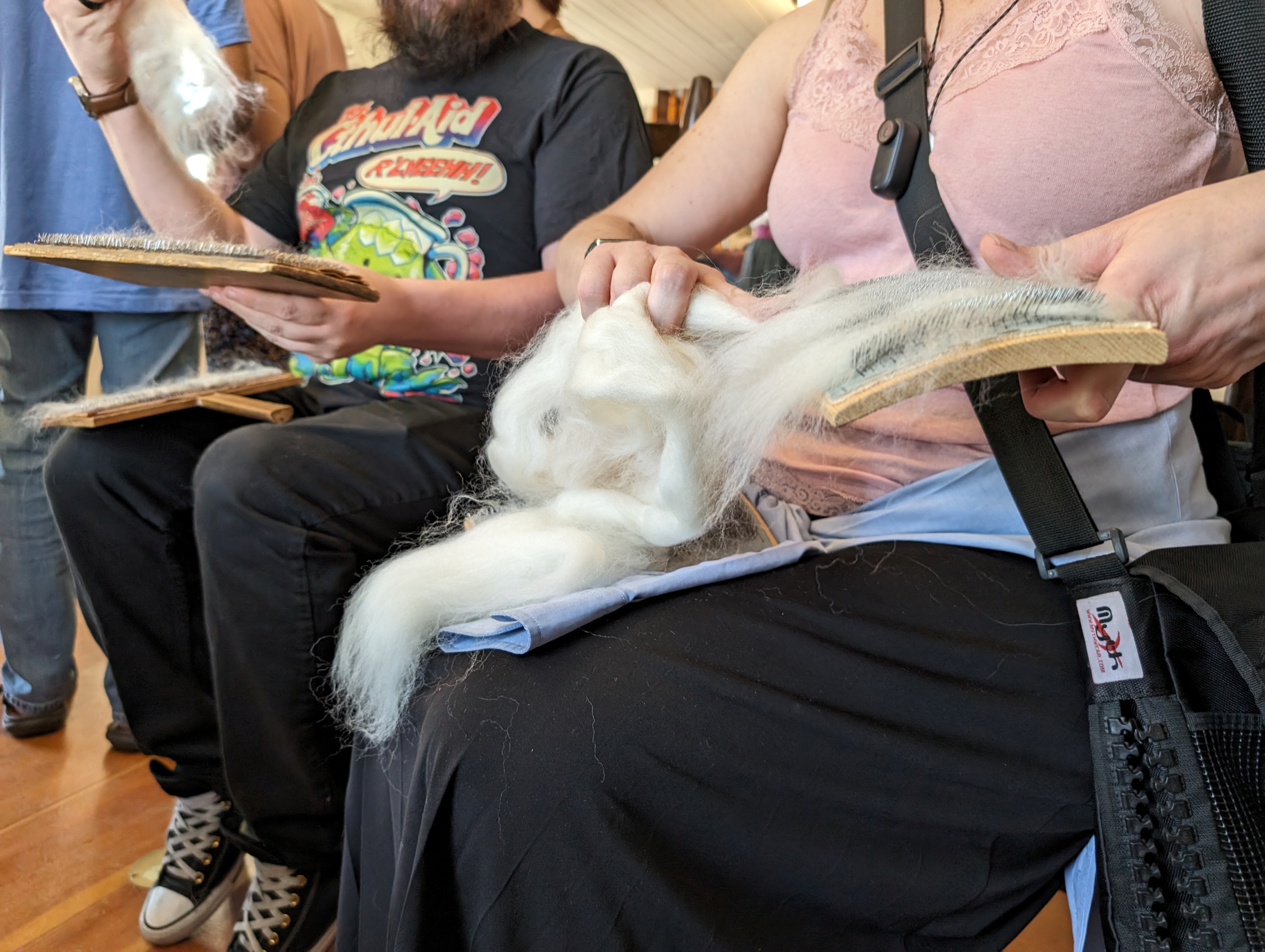 Kevin Braun, left, and Lisa Holloway take their crack at carding wool on Saturday.Carding wool, which is essentially combing, helps straighten the wool and get rid of any unwanted debris before it is ran through a spinner. (SageKelleyJefferson County Reportersage.kelley@denvergazette.comhttps://denvergazette.com/content/tncms/avatars/e/5f/457/e5f45740-2717-11ee-85b2-ab80f2d36252.5b966c1d2ce4987987665d57c237eda4.png)