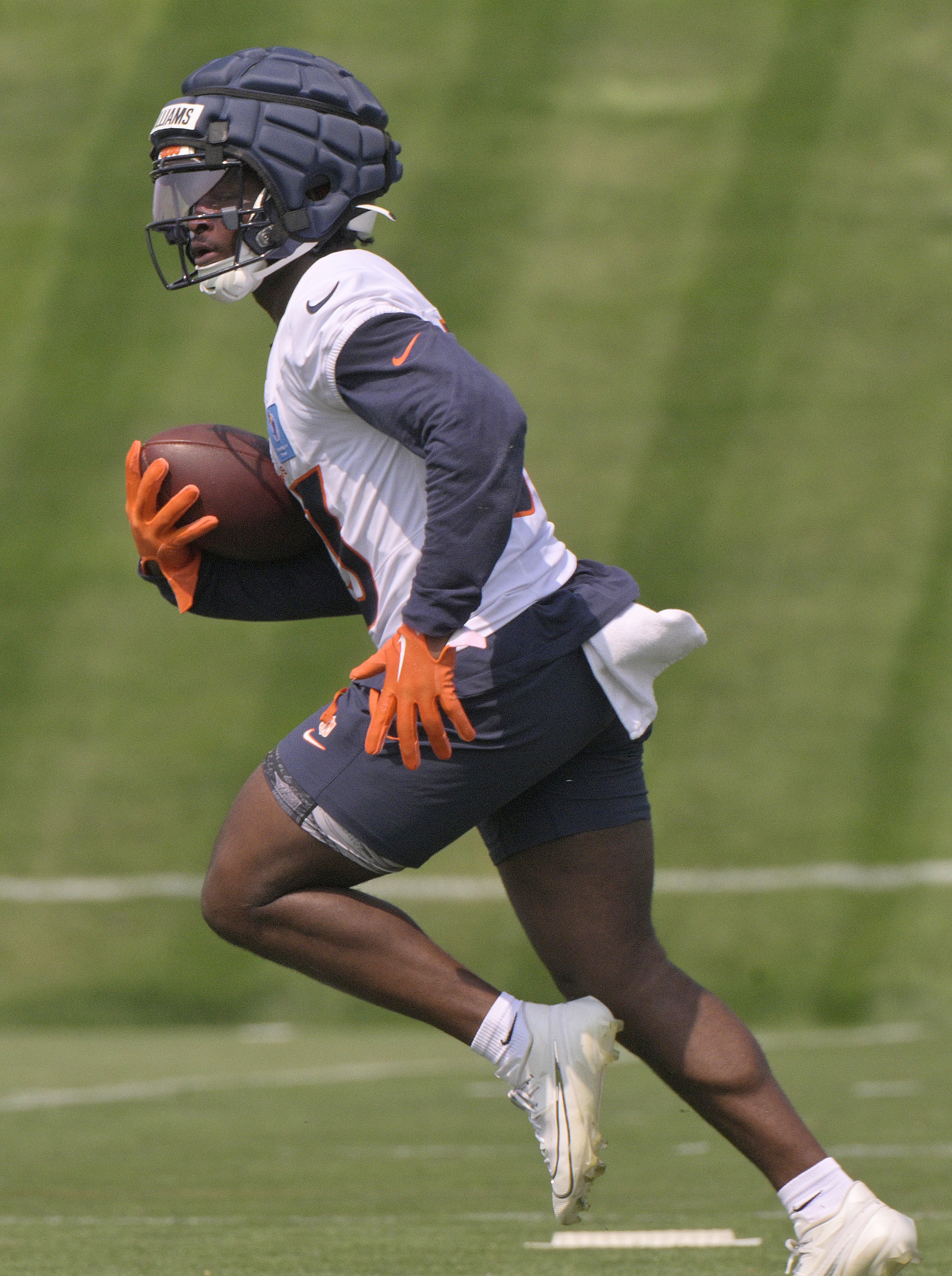 Broncos running back Javonte Williams runs with the ball during practice at the Denver Broncos training center on Wednesday, July 24, 2024. (Jerilee Bennett The Gazette)