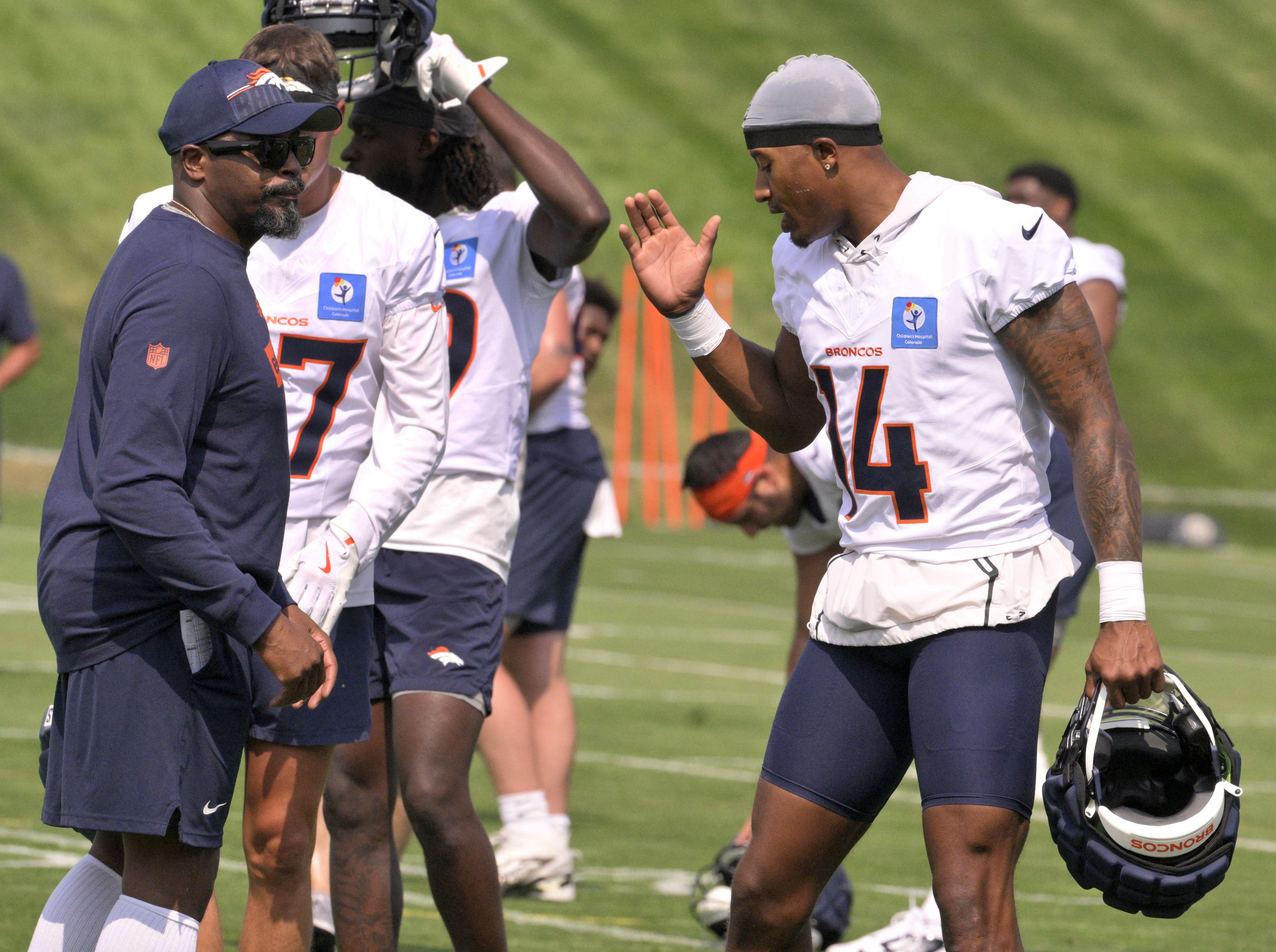 Broncos wide receiver Courtland Sutton chats with one of the coaches during practice at the Denver Broncos training center on Wednesday, July 24, 2024. (Jerilee Bennett The Gazette)