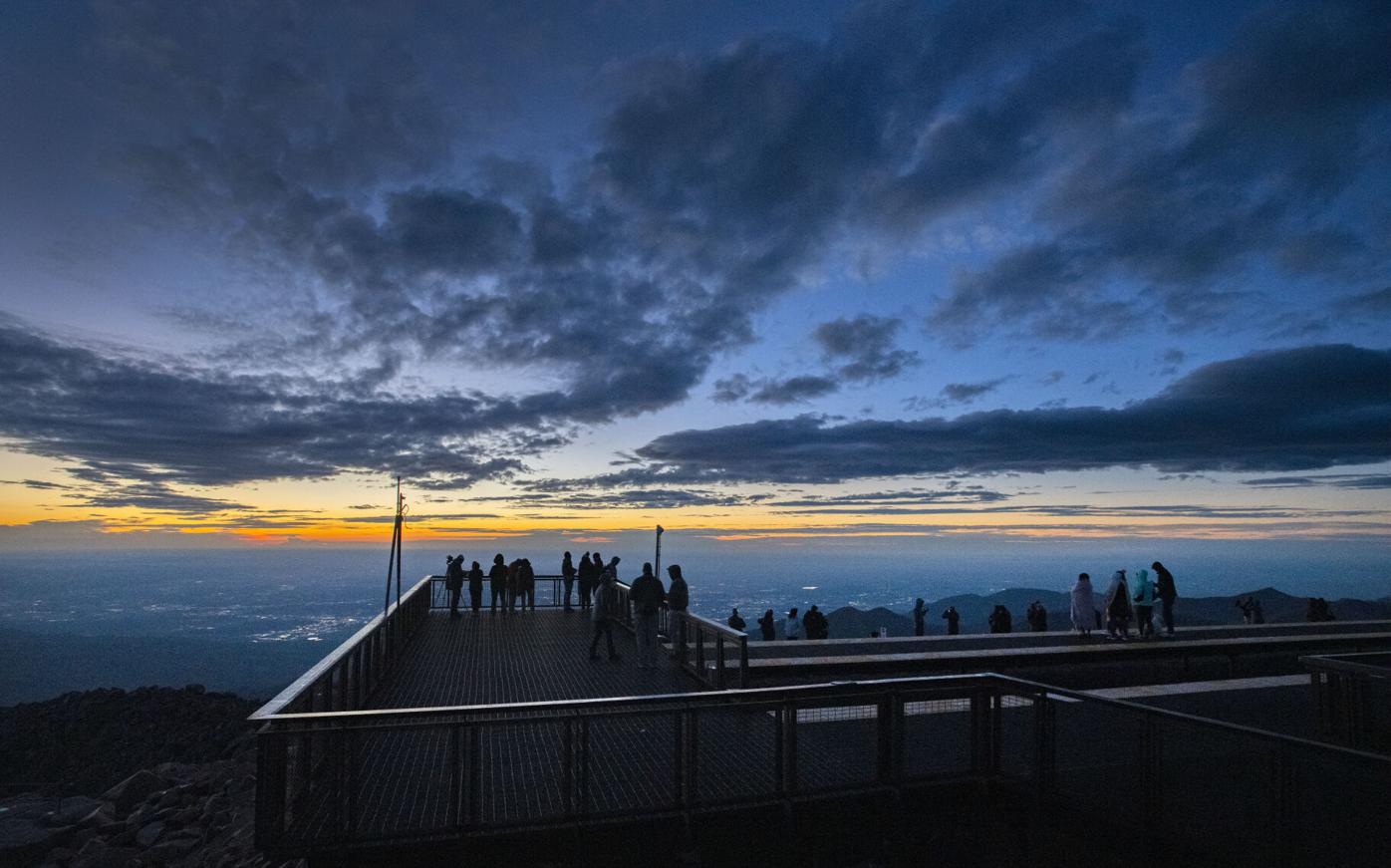 Drive or ride train up Pikes Peak for rare sunrise opening