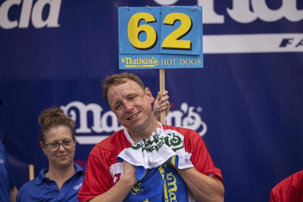 Joey Chestnut and soldiers compete in July Fourth hot dog eating contest at Army base
