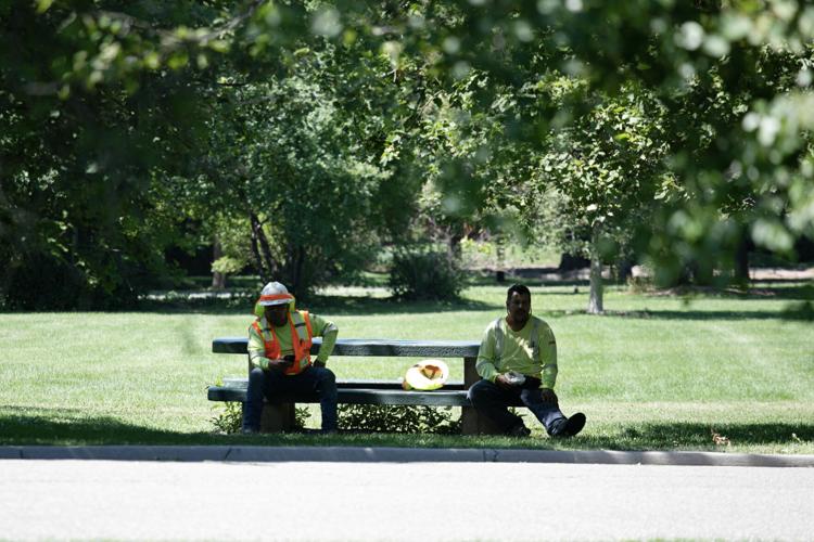 Electric workers take a break in the shade