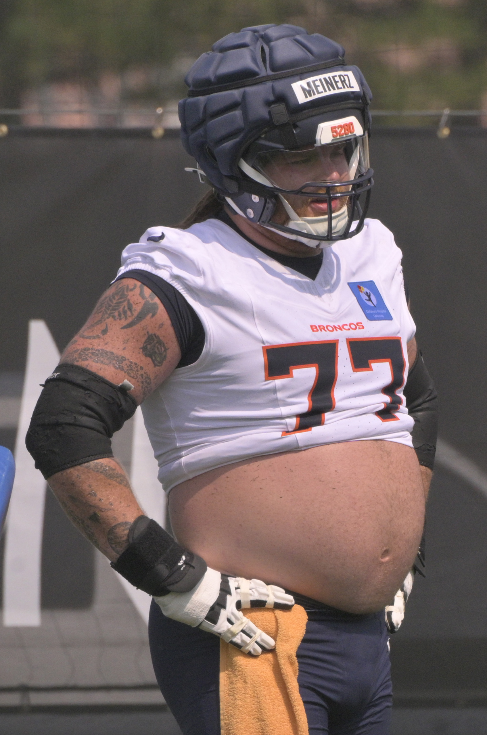 Broncos guard Quinn Meinerz lets it all hang out during practice at the Denver Broncos training center on Wednesday, July 24, 2024. (Jerilee Bennett The Gazette)