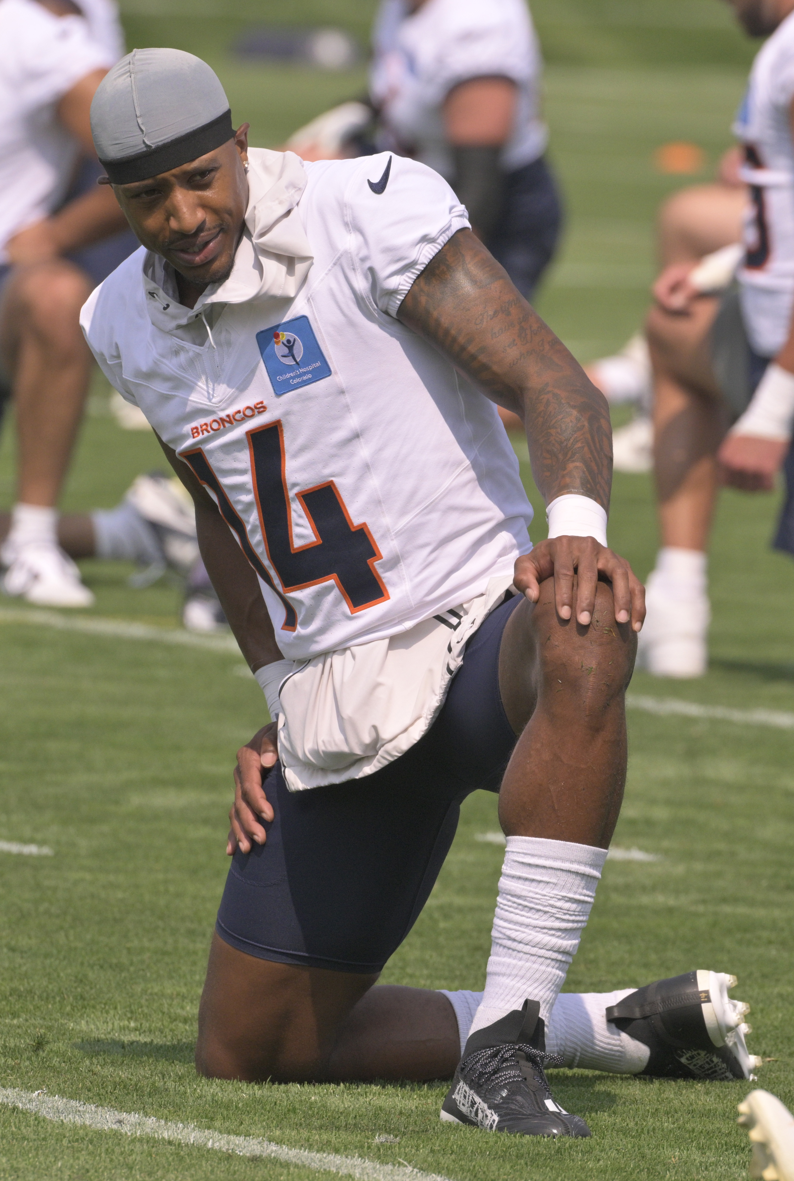 Broncos wide receiver Courtland Sutton stretches during practice at the Denver Broncos training center on Wednesday, July 24, 2024. (Jerilee Bennett The Gazette)