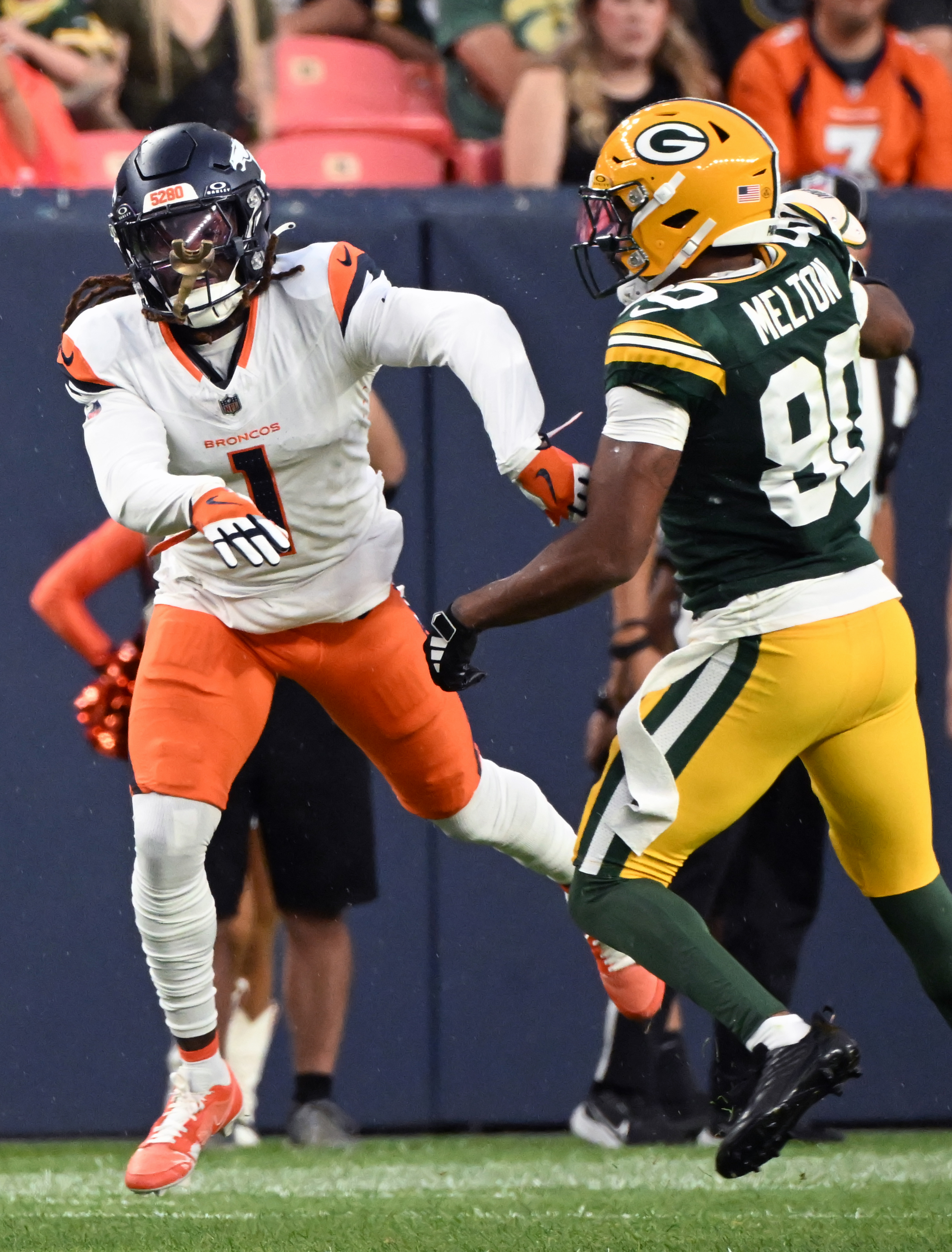 Denver Broncos cornerback Tremon Smith (1) goes after Green Bay Packers wide receiver Bo Melton (80) during a preseason game against the Packers on Sunday, Aug. 18, 2024. The Broncos won the game 27-2. (Jerilee Bennett, The Gazette)