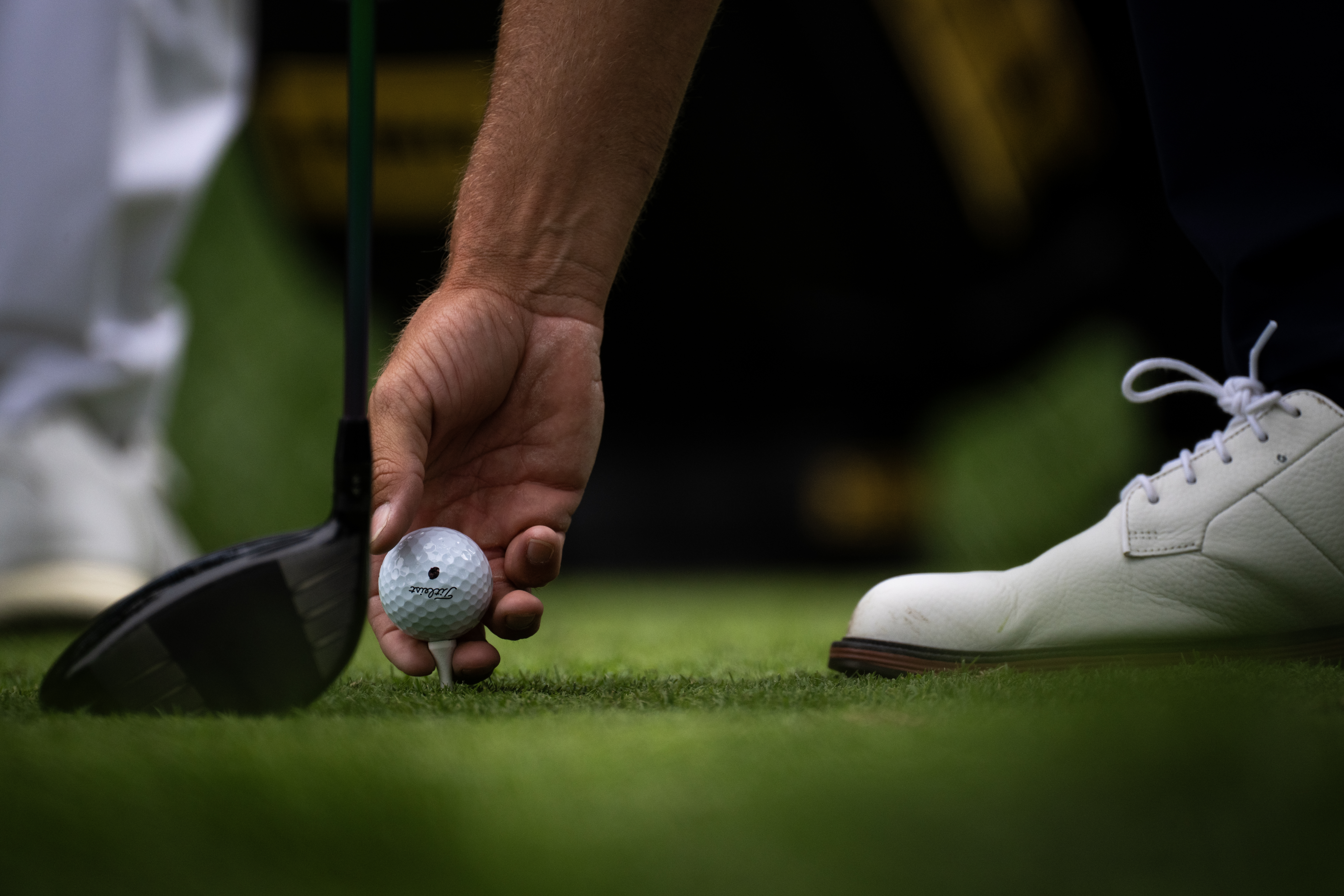 Wyndham Clark places his ball on a tee during the third round of the BMW Championship golf event at Castle Pines Golf Club, Saturday, Aug. 24, 2024, in Castle Rock, Colo. (Parker Seibold, The Gazette) (Parker Seibold, The Gazette)