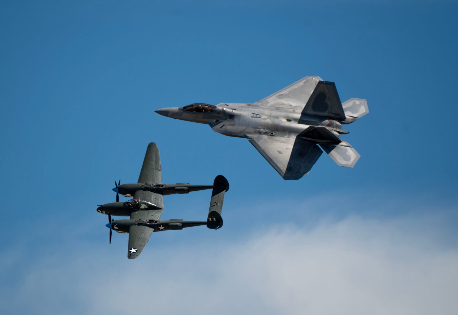 A F-22 Raptor and a P-38 do a heritage pass in honor of military members the Pikes Peak Regional Airshow at the Colorado Springs Airport on Saturday, Aug. 17, 2024. (Parker Seibold, The Gazette) (Parker Seibold, The Gazette)