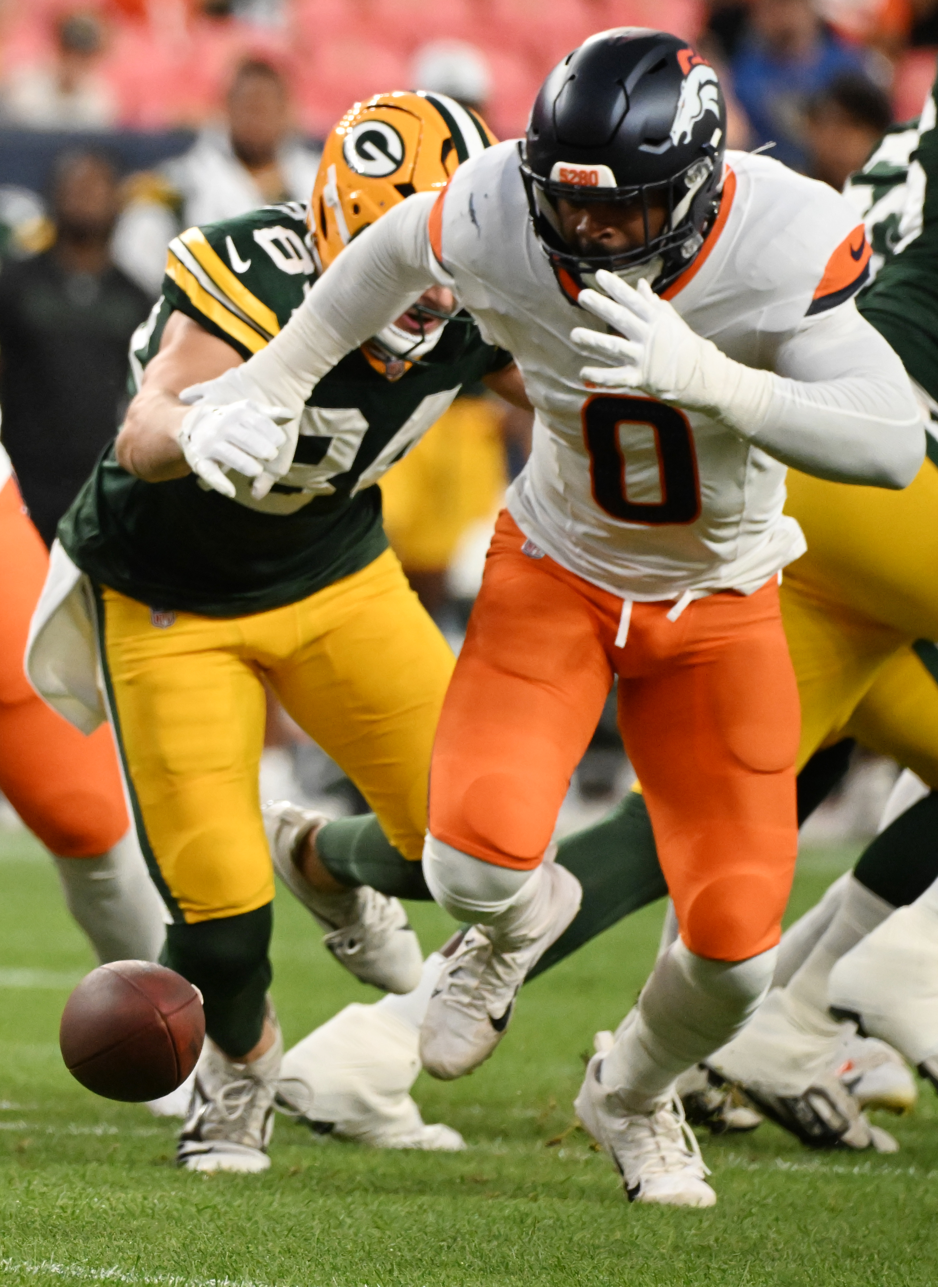 Denver Broncos linebacker Jonathon Cooper (0) goes after a loose ball during a preseason game against the Packers on Sunday, Aug. 18, 2024. The Broncos won the game 27-2. (Jerilee Bennett, The Gazette)