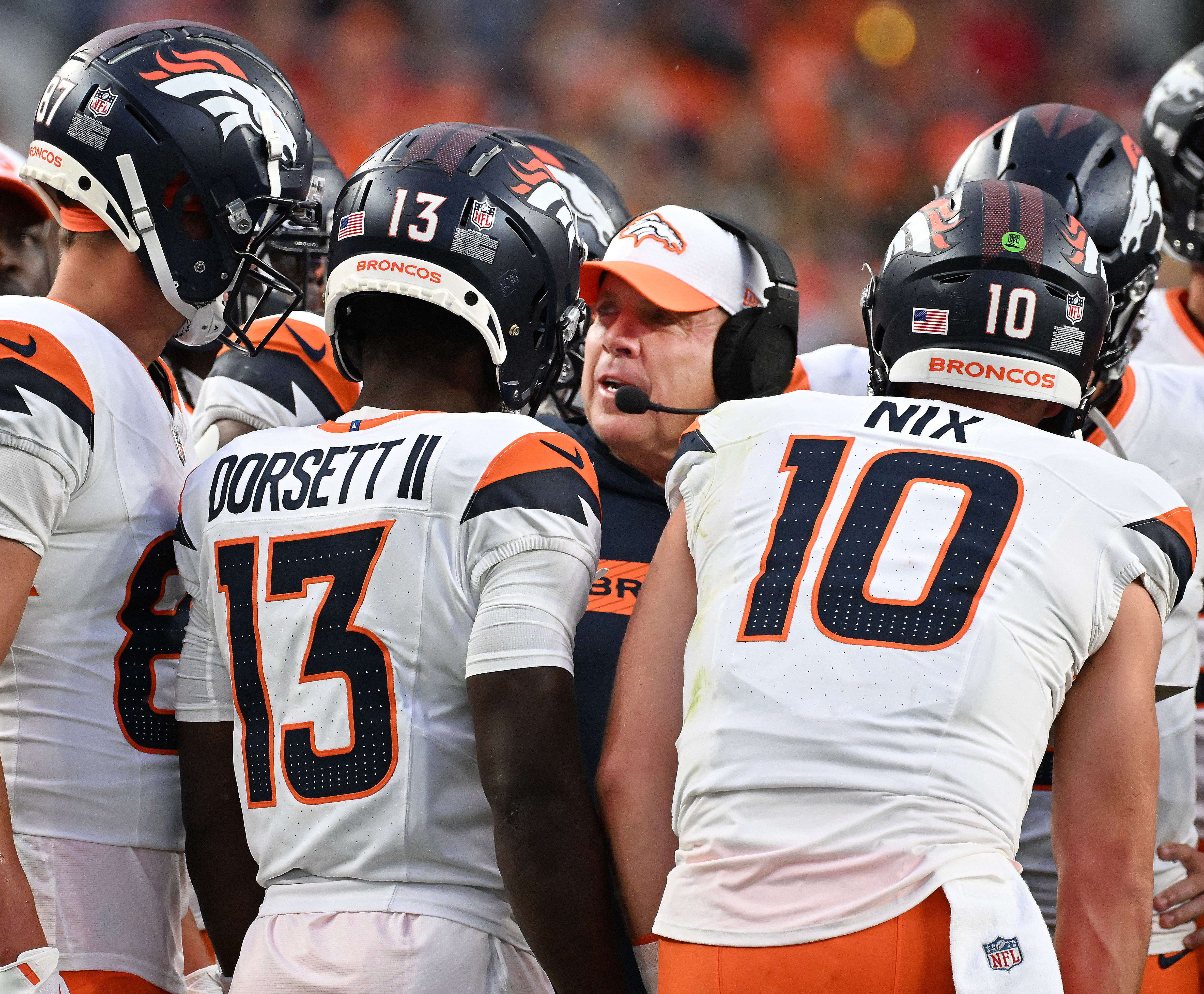 Broncos Head Coach Sean Payton chats with the offense during the first quarter of a preseason game against the Packers on Sunday, Aug. 18, 2024. (Jerilee Bennett The Gazette)